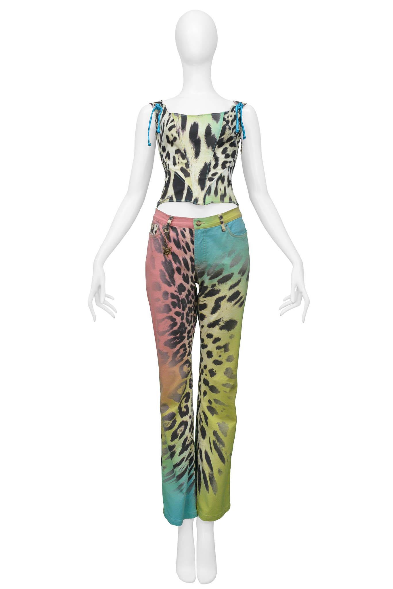 Resurrection Vintage is excited to present a vintage burgundy Roberto Cavalli rainbow leopard corset top featuring, blue cord ties on the shoulder, a lace-up back, a fairy charm on the side zipper, and a Just Cavalli metal charm.  Roberto Cavalli