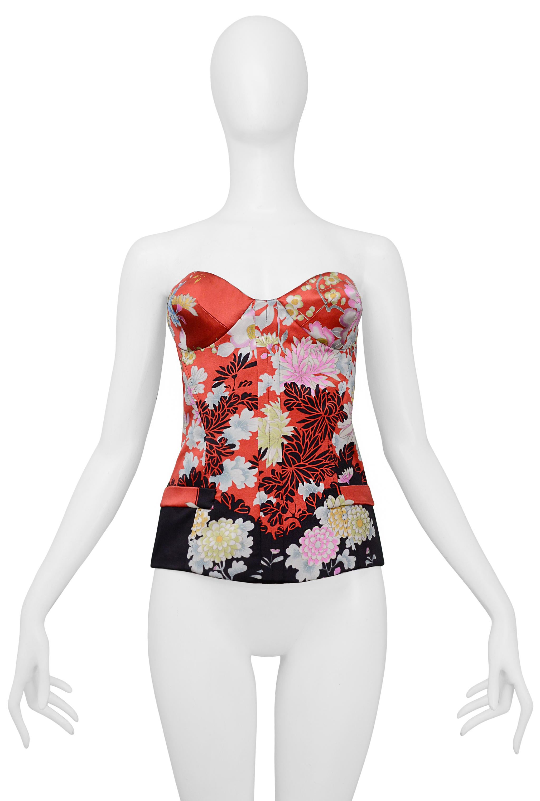 Resurrection Vintage is excited to present a vintage Roberto Cavalli red satin corset top featuring floral obi-style fabric, center snap and hook and eye closures, side pockets, and bustier detailing at the bust. 

Roberto Cavalli
Size: 40
Silk