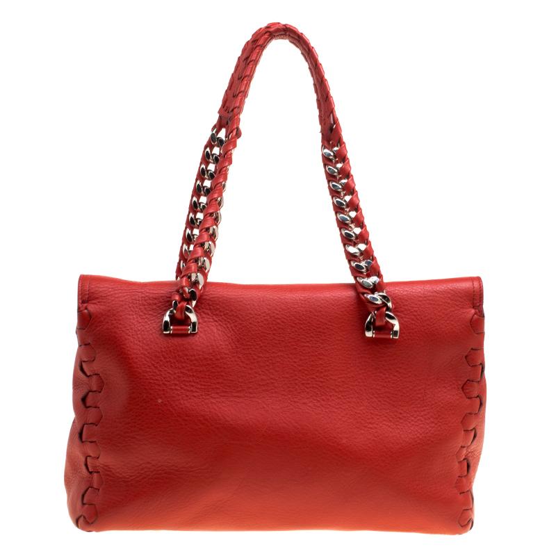 Ravishing in red, this Regina satchel from Roberto Cavalli is sure to add sparks of luxury to your closet! The satchel is crafted from leather and features a chic silhouette. It flaunts a silver-tone brand logo at the front, a front flap closure,