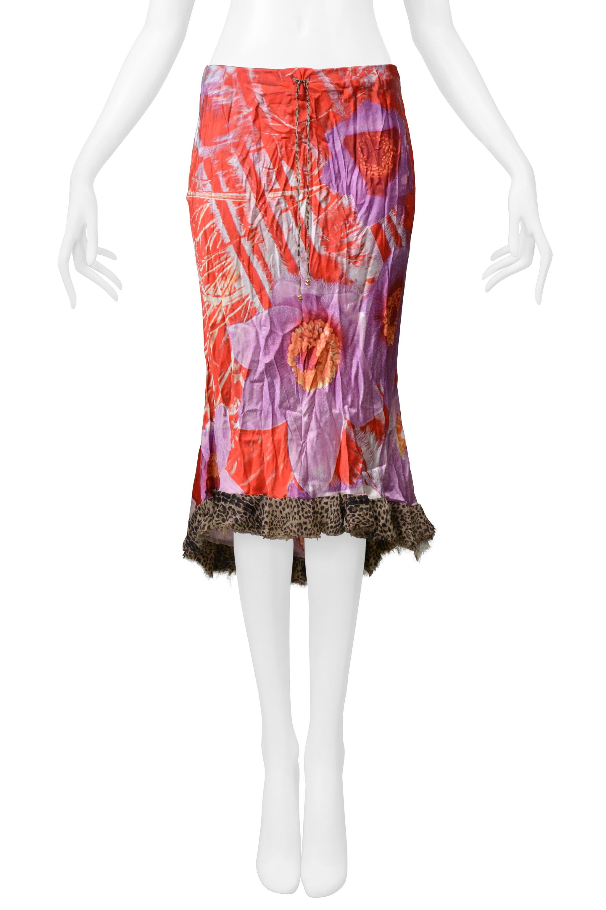 Resurrection Vintage is delighted to offer a vintage Roberto Cavalli red & purple leopard and floral two-piece set. The top features a gold chain halter neck adorned with crystals, leopard print, and is backless. The skirt features a bias cut, an