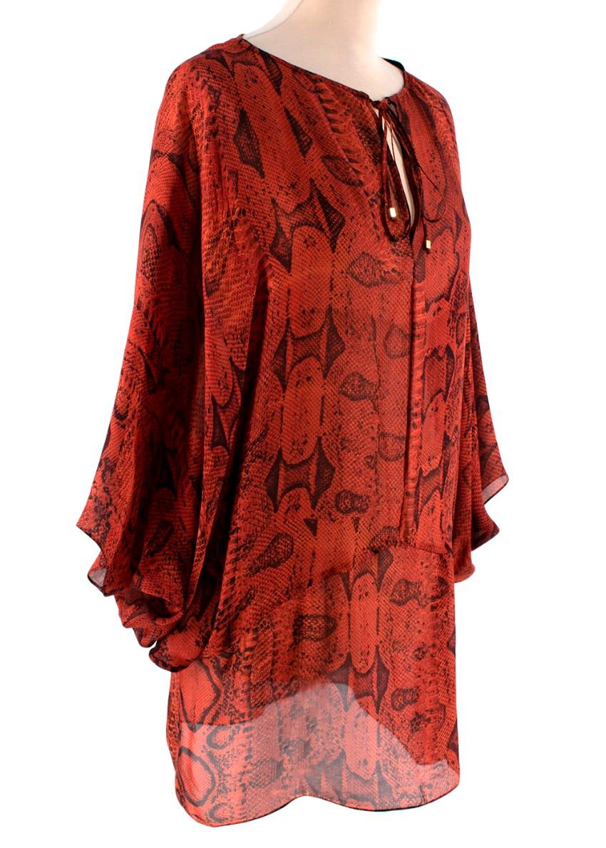 Roberto Cavalli Red Silk Snake Print Peasant Blouse
 

 - Signature, floaty peasant style blouse evocative of the Roberto Cavalli house codes
 - All over python skin print rendered in black on a deep orange-red silk chiffon
 - Self-tie rouleaux
