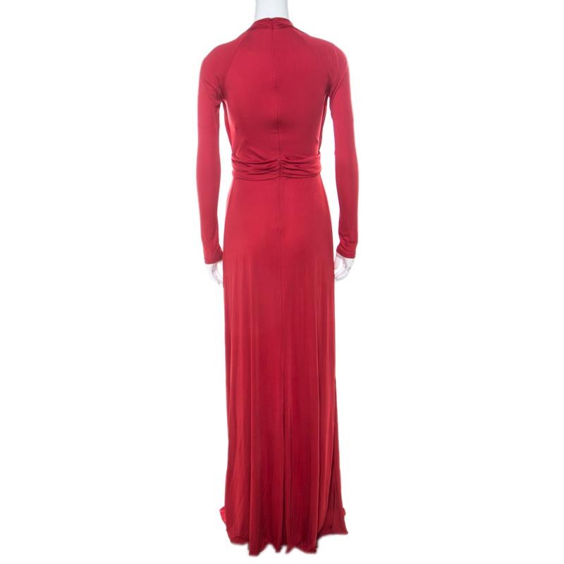 Coming from Roberto Cavalli, this dress is sure to garner a lot of compliments. Feminine and effortless, this dress in red features long sleeves and an embellished brooch detail on the front. This dress, masterfully tailored in blended fabric, is an