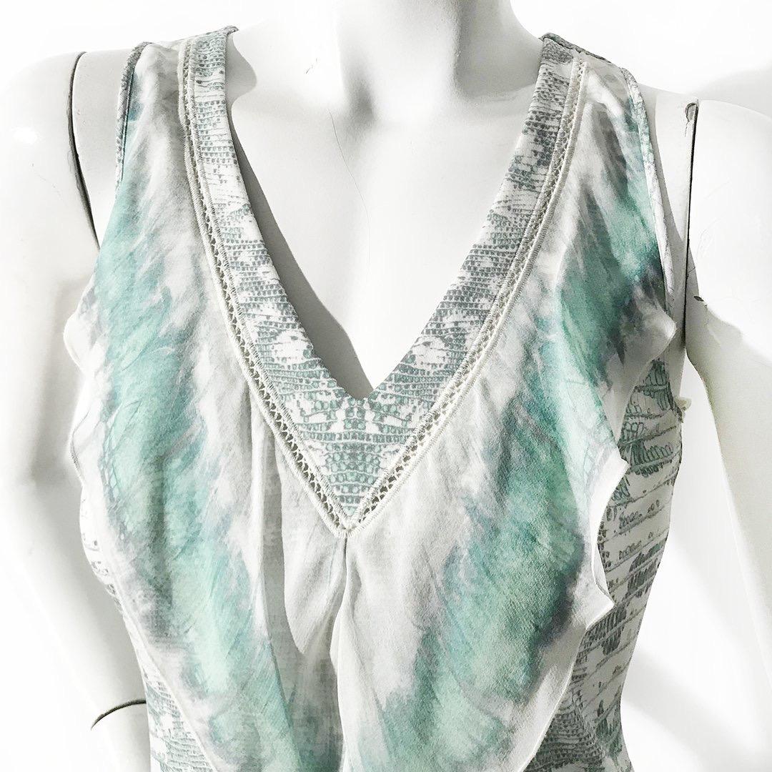 Reptile Ruffle Dress by Roberto Cavalli
Circa early 2000's
Green and white reptile print 
Chiffon ruffle detail at front and bottom hem 
Decorative stitching around collar
Viscose base with silk top layer 
Made in Italy
Condition: Excellent, little