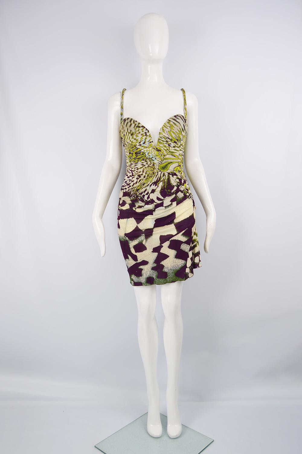 A sexy vintage Roberto Cavalli sleeveless party dress from Fall 2003 in a green patterned jersey with a built in corset/ boning. It has a sexy, plunging neckline that can be made more modest with a hook and eye and amazing draping. 

Size: Marked