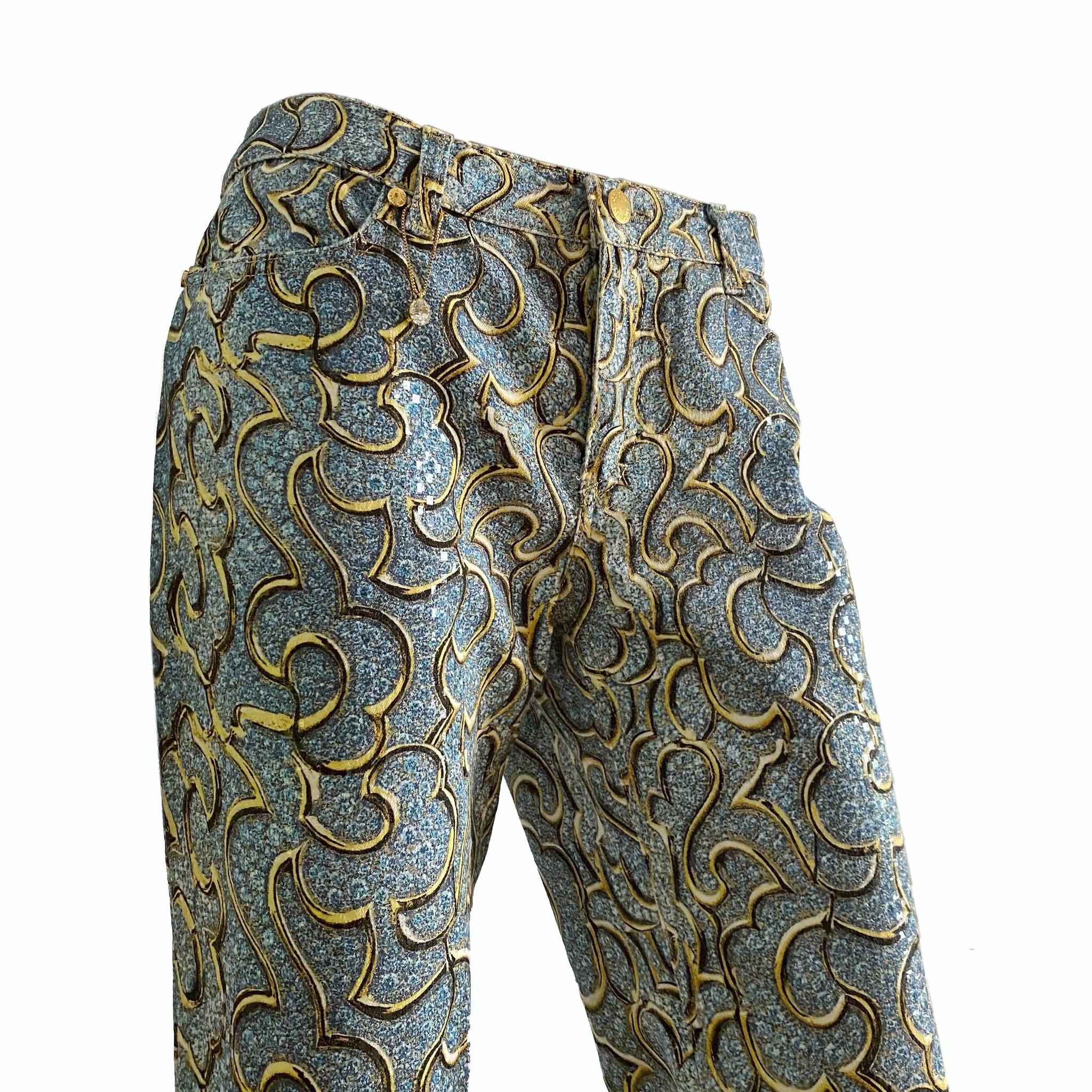 Roberto Cavalli blue Capri pants with clear micro sequins and gold baroque print from Spring/Summer 2000 collection (seen both on runway and campaign). Gold version seen on Aaliyah

Size L

Waistline: 82 cm / 32,2 inch
Front rise: 23 cm / 9