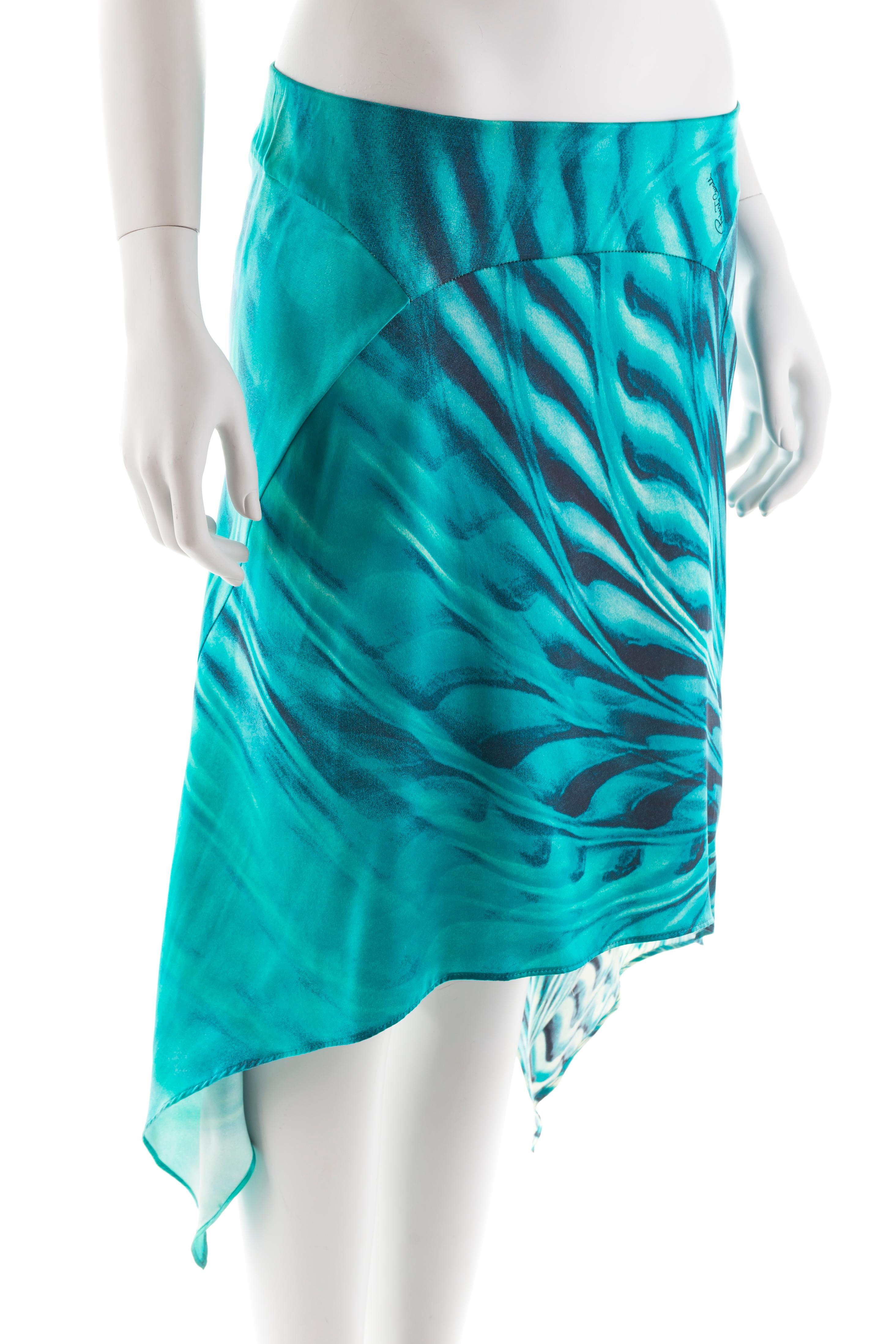 - Roberto Cavalli asymmetric silk midi skirt
- Sold by Gold Palms Vintage
- Spring/Summer 2001
- Blue/turquoise graphic “peacock” swirl print
- Elastic waistband
- Ruffled sides
- No size label
