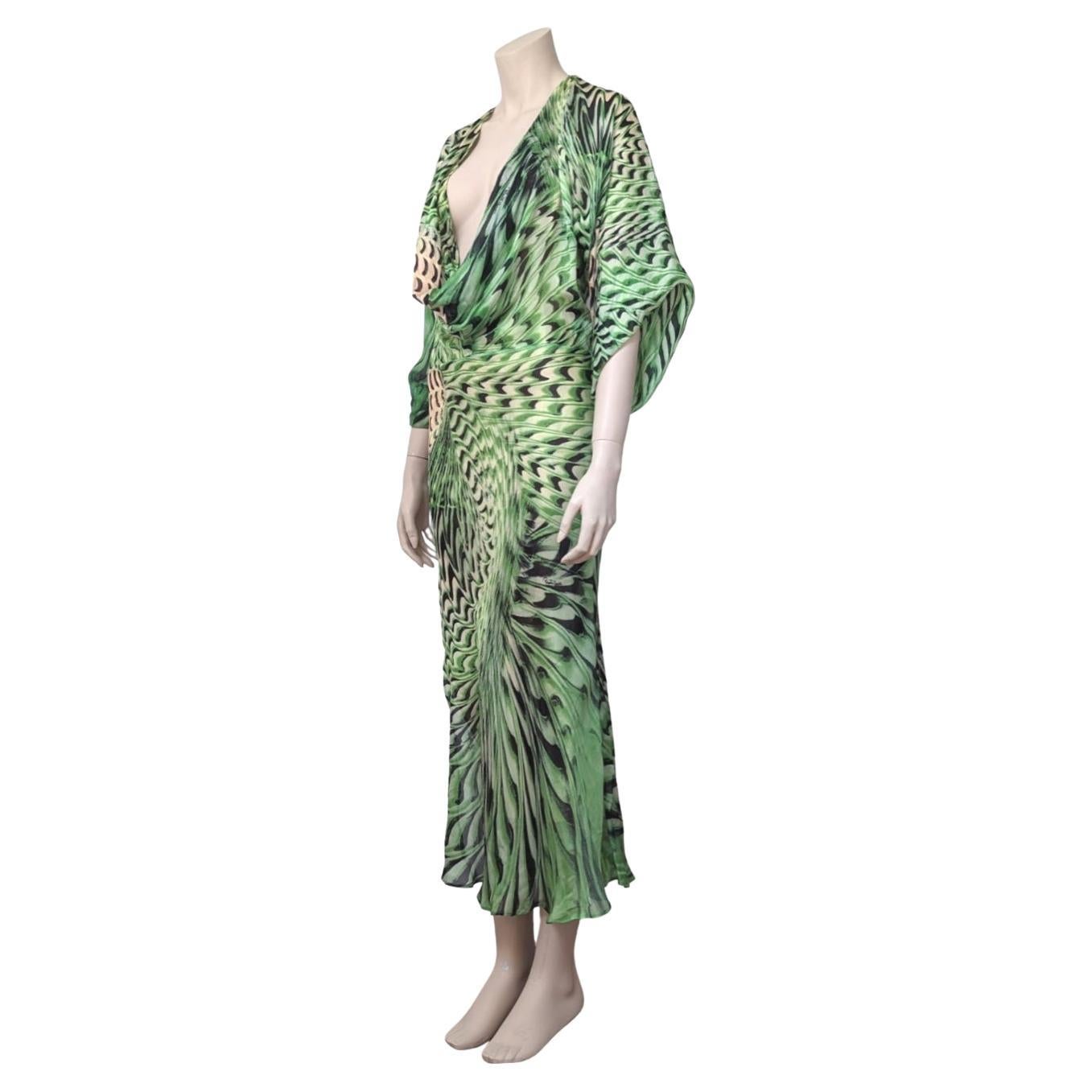 Sheer psychedelic green silk high slit. Seen on the Spring / Summer 2001 runway.

· Comes with a beige silk deep V neckline under dress 
· Invisible Buttons on the side
· Mermaid Cut

Fits S - Original tag Label XXS

Flat measurements :

Breast : 40