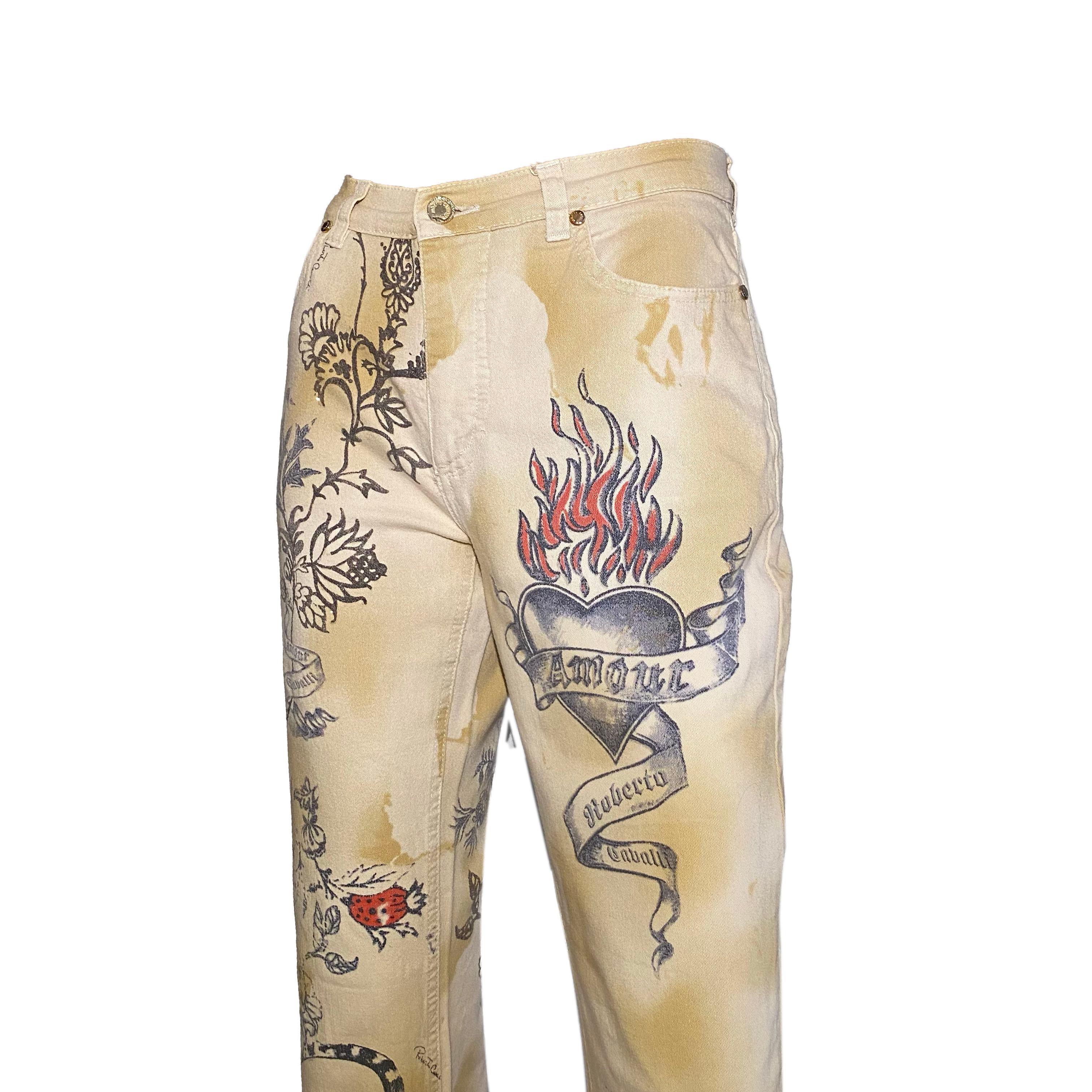 Roberto Cavalli beige/cream jeans with old-school style tattoo print from the Spring/Summer 2003 collection. 

Size label missing, fits S/M

Waistline: 75 cm / 29.5 inch
Inseam: 76 cm / 29.9 inch
Outseam: 102 cm / 40.1 inch