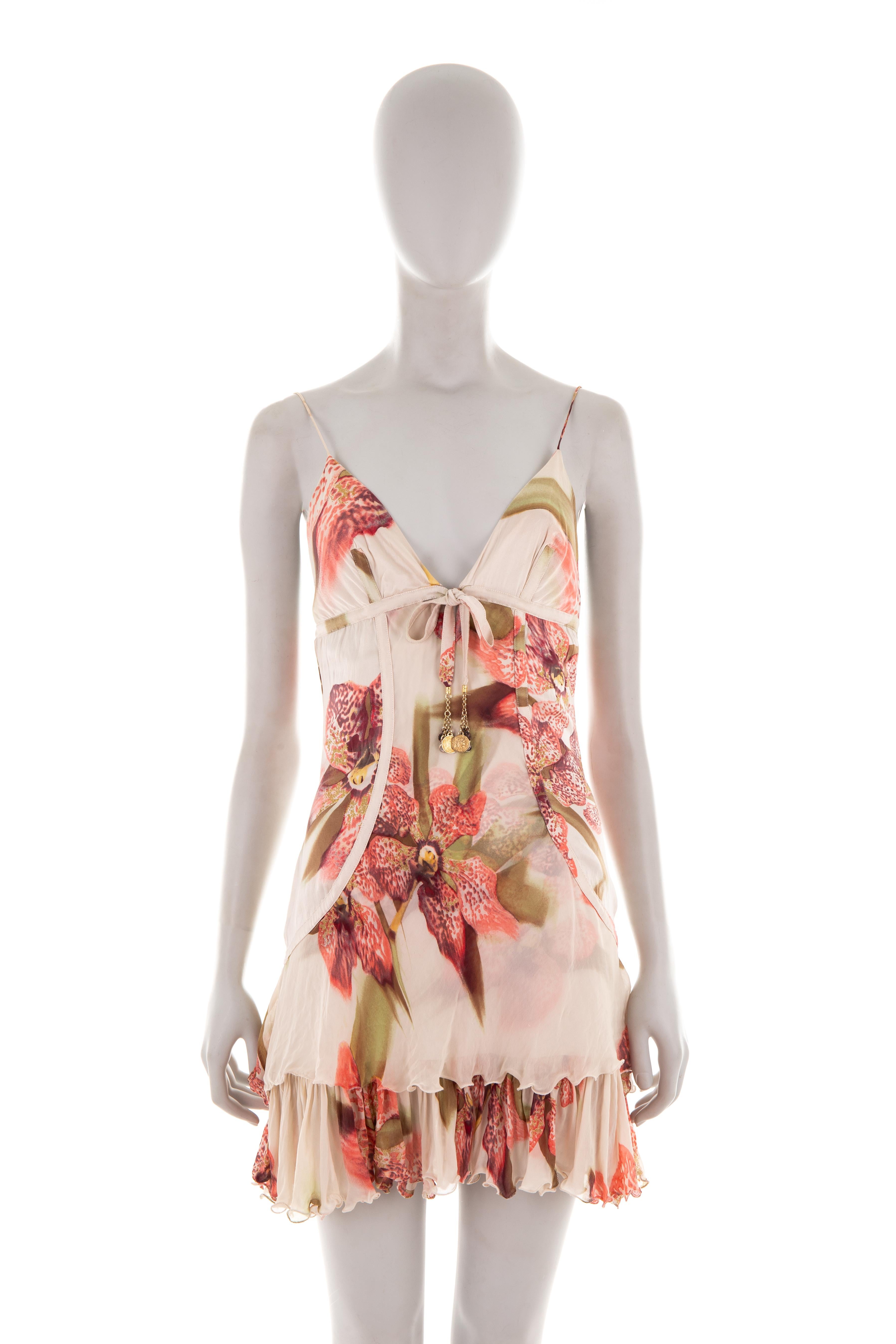 - Roberto Cavalli spring-summer 2004 collection 
- Sold by Gold Palms Vintage
- Silk ruffled mini dress
- Pink Lily print
- V-neckline with spaghetti straps
- Silk ribbon with metal coin charms 
- Multi-layered silk chiffon ruffled skirt 
- Size: S