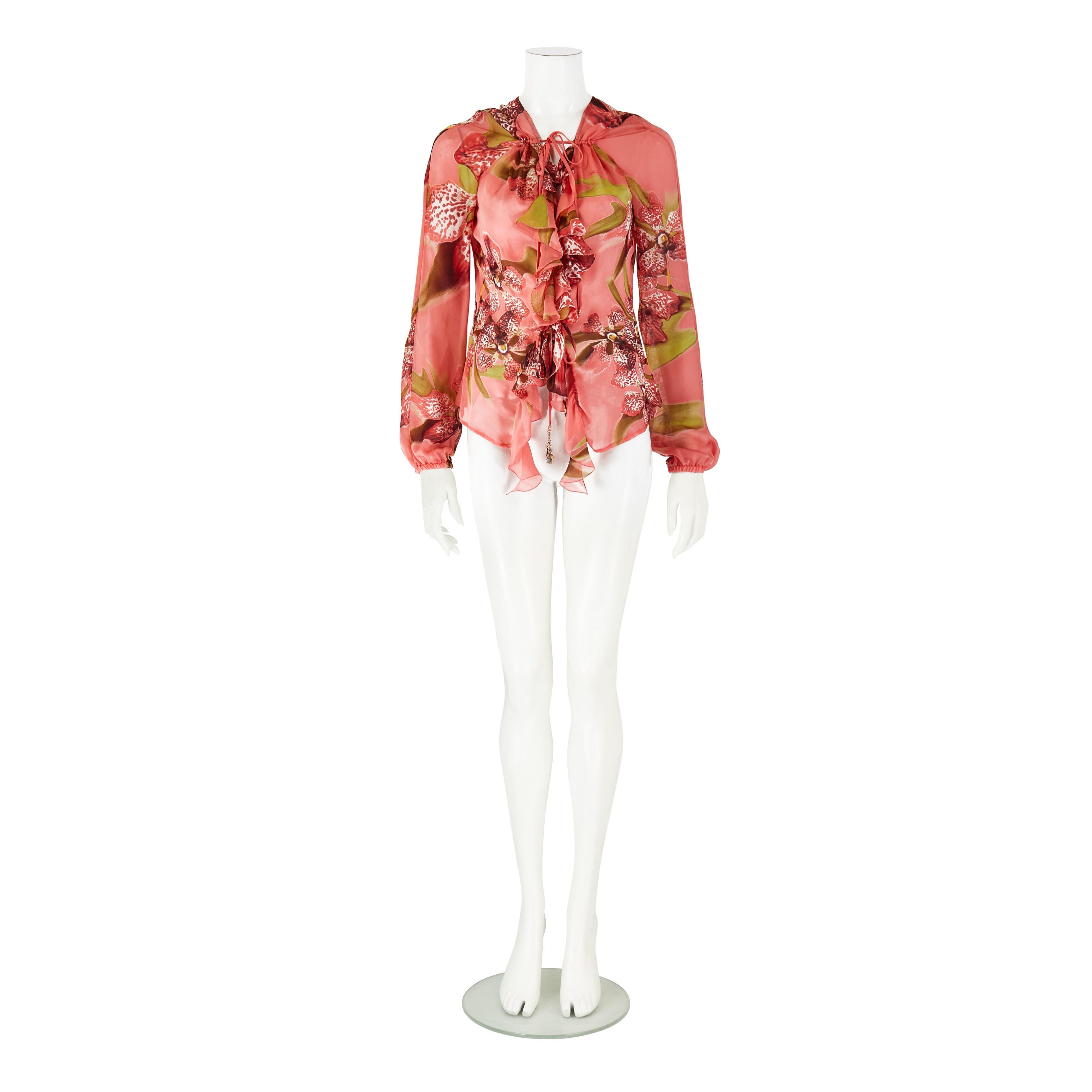 Interdite Vintage presents a Roberto Cavalli S/S 2005 Orchid Floral Print Silk Blouse Top

• Roberto Cavalli

• From the Spring / Summer 2005 collection

• Featuring gold hardware and a tie neckline

• Made in Italy

Size:
L - IT 46 - US 10 - UK