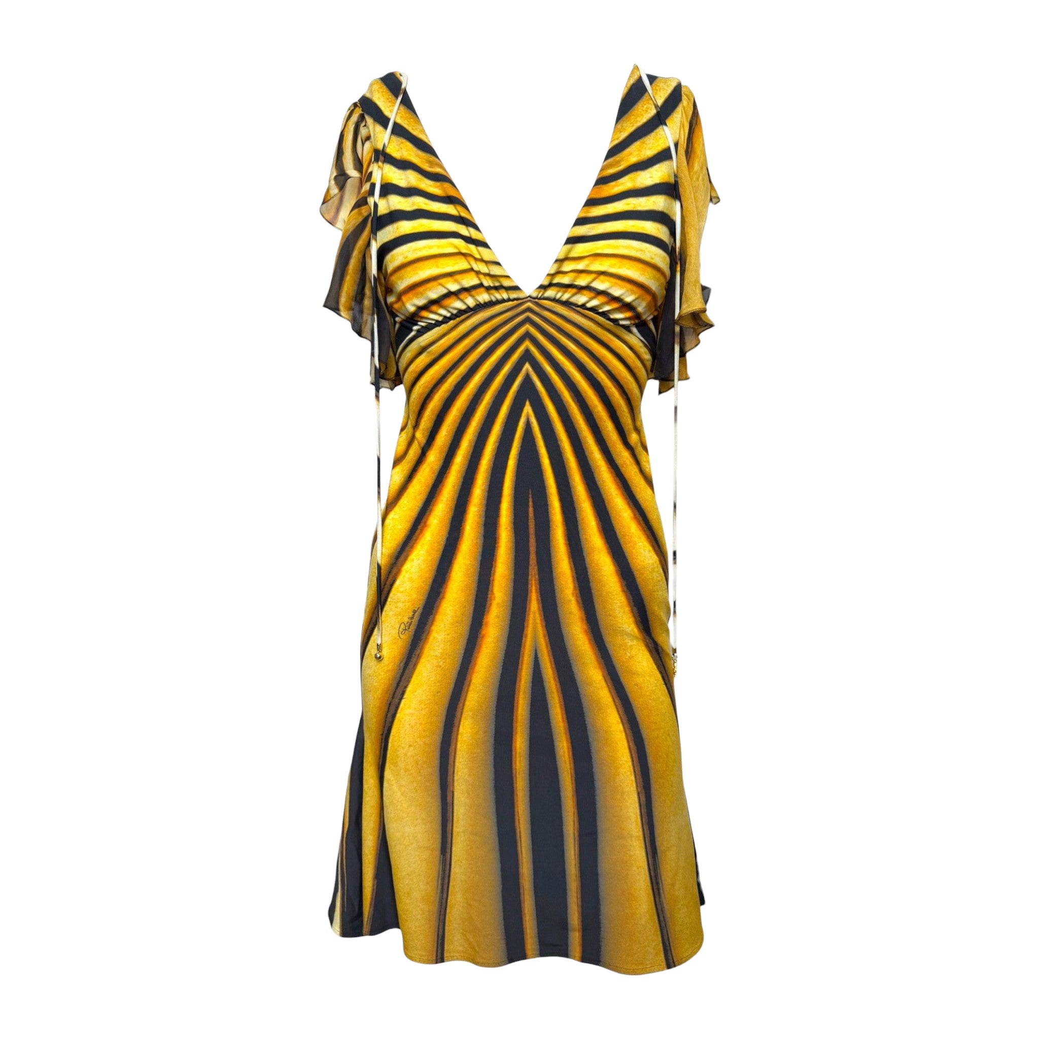 Vestido mini de Roberto Cavalli, primavera-verano 2007, en color ámbar y negro con estampado de tigre y mangas con volantes