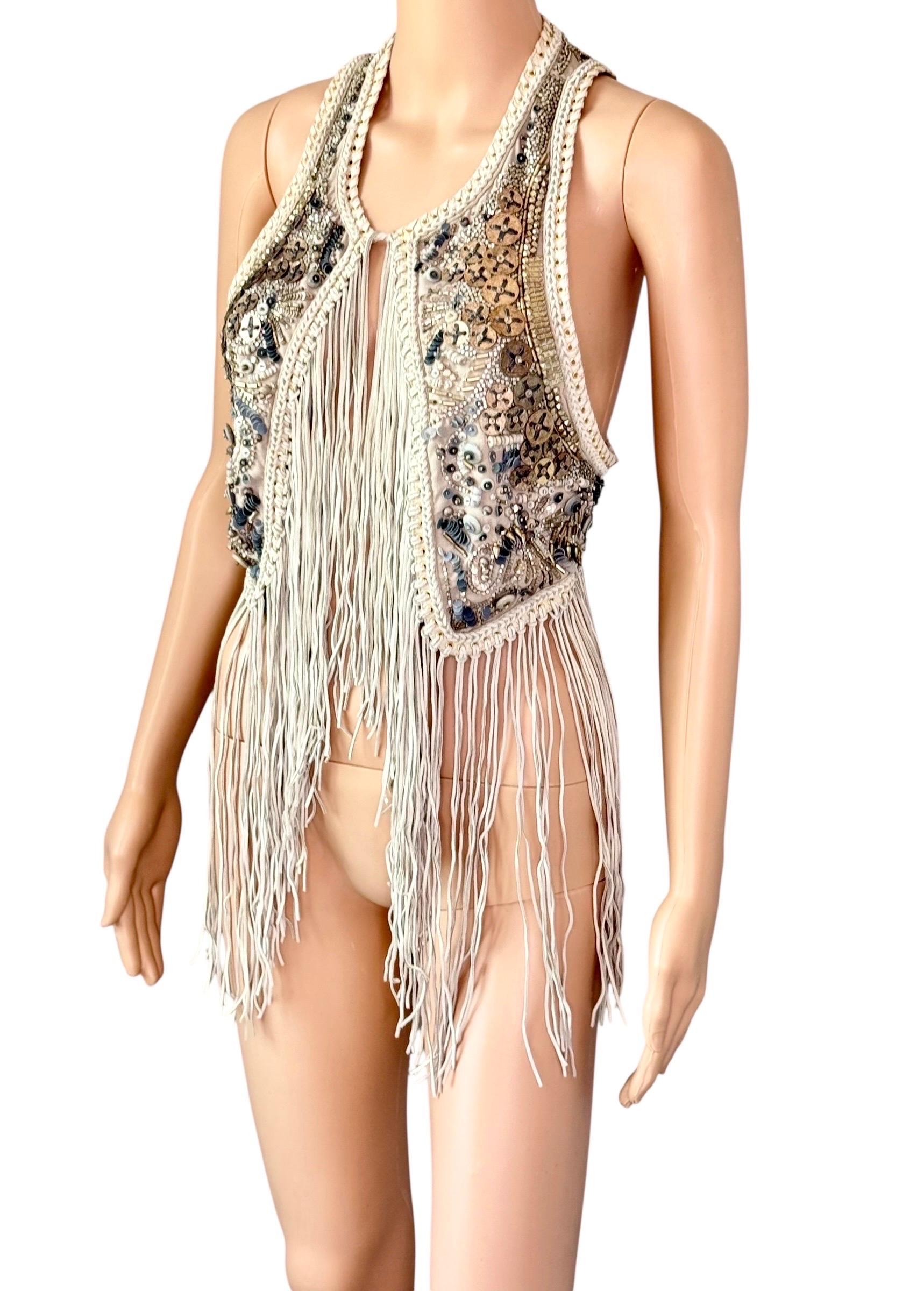 Roberto Cavalli - P/E 2011 - Giacca gilet con frange in pelle impreziosita e non indossata

Taglia: IT 44

Condizioni: Nuovo con tag
