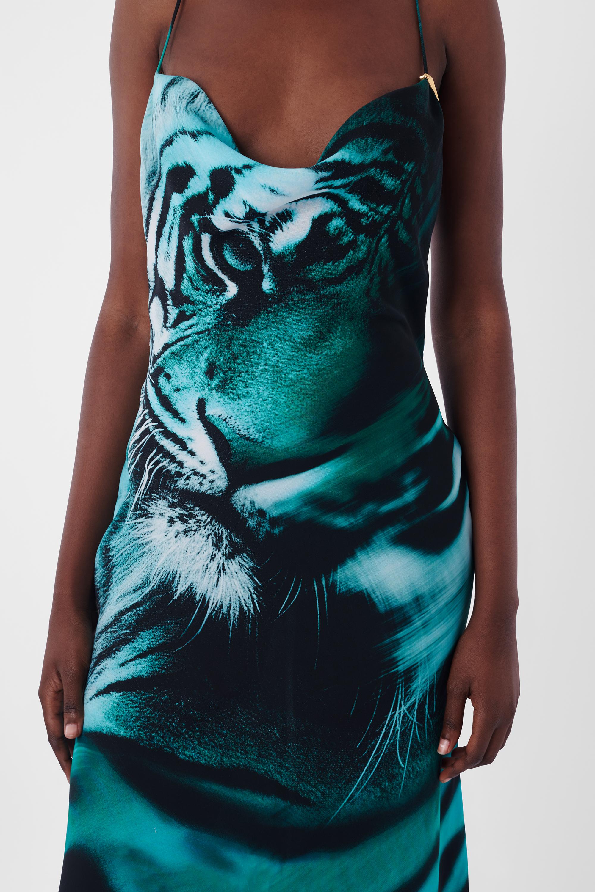 We are excited to present this incredible Roberto Cavalli S/S 2022 Blue Tiger Dress. Features cowl neck, open back with concealed zipper, gold tiger teeth on straps, asymmetric hem. In excellent vintage condition. As seen on Dua Lipa. Authenticity