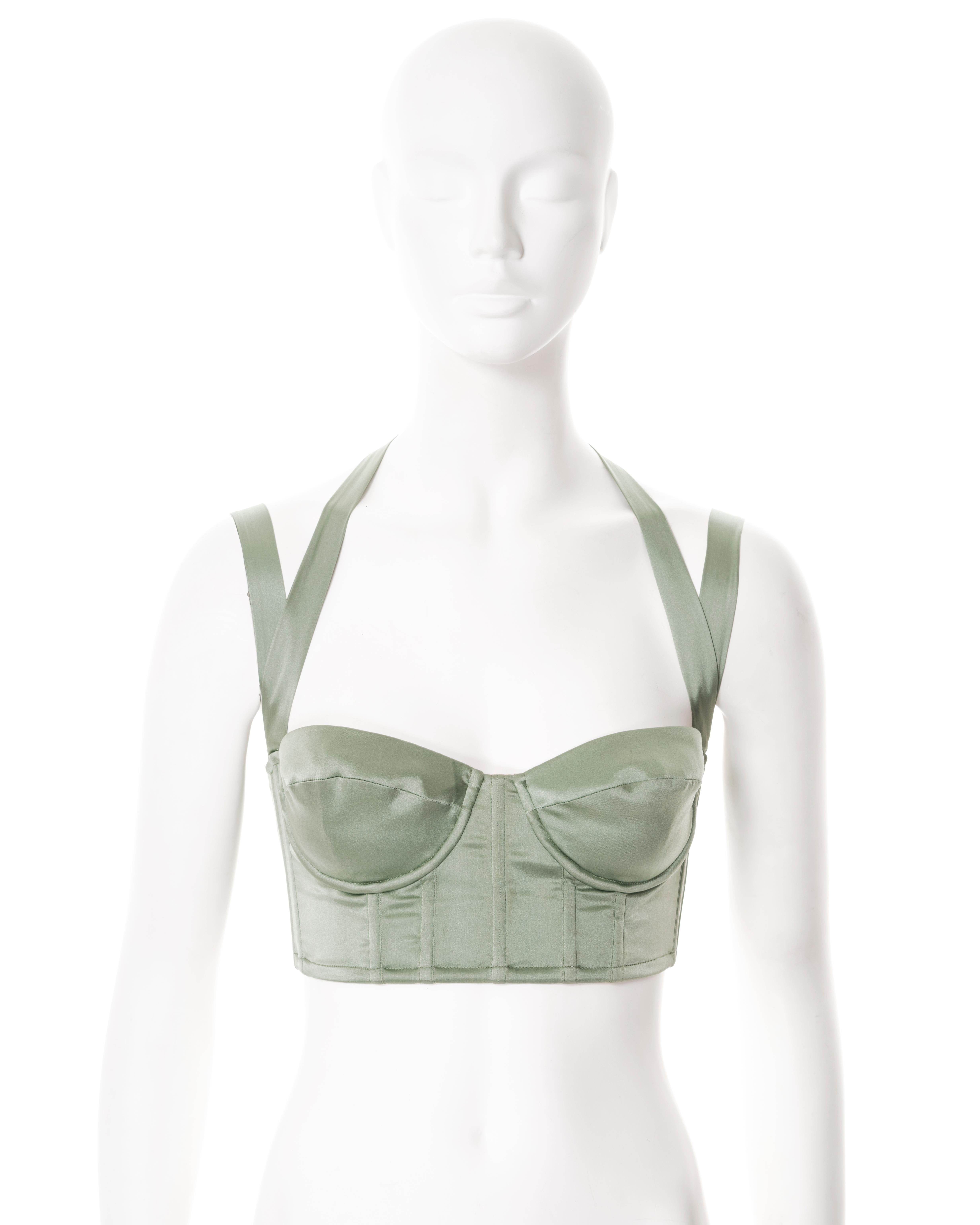 ▪ Roberto Cavalli cropped bustier / corset 
▪ Sold by One of a Kind Archive
▪ Constructed from sage green silk 
▪ Halter-neck ties with chain and feather adornments 
▪ Lace-up fastening
▪ Size Medium
▪ Made in Italy

All photographs in this listing