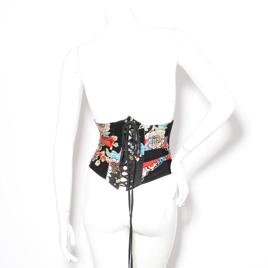 Product Details:
Satin floral corset by Roberto Cavalli 
Spring 2003
Multicolor peony print 
Layered silk 
Boning on sides 
Lace up back 
Front metal tab closure 
Sits under bust
Made in Italy
Condition: Great, some loose strings. little to no