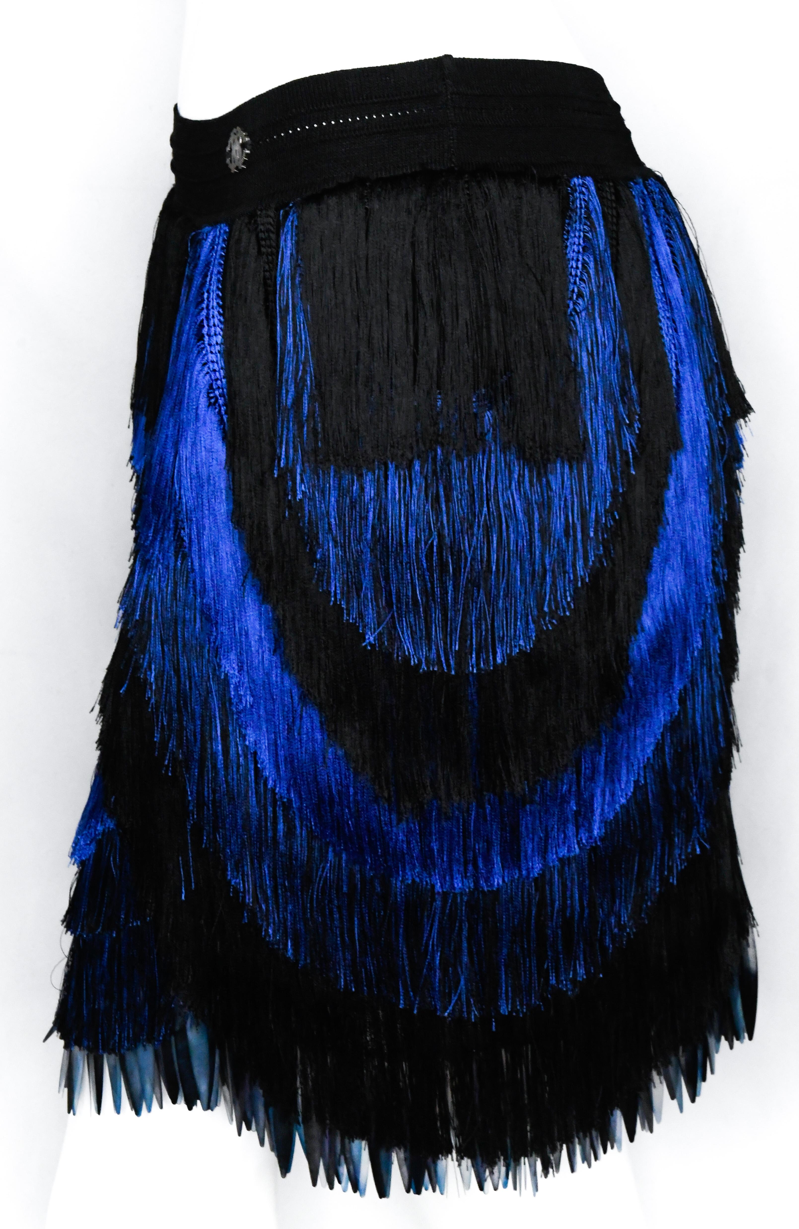 Roberto Cavalli is known for festive and eye-catching pieces.  This skirt is no exception.  Features stretch material, scalloped electric blue and black tiered fringe all over, and banded waist.  The finishing touch?  Entire hem is decorated by