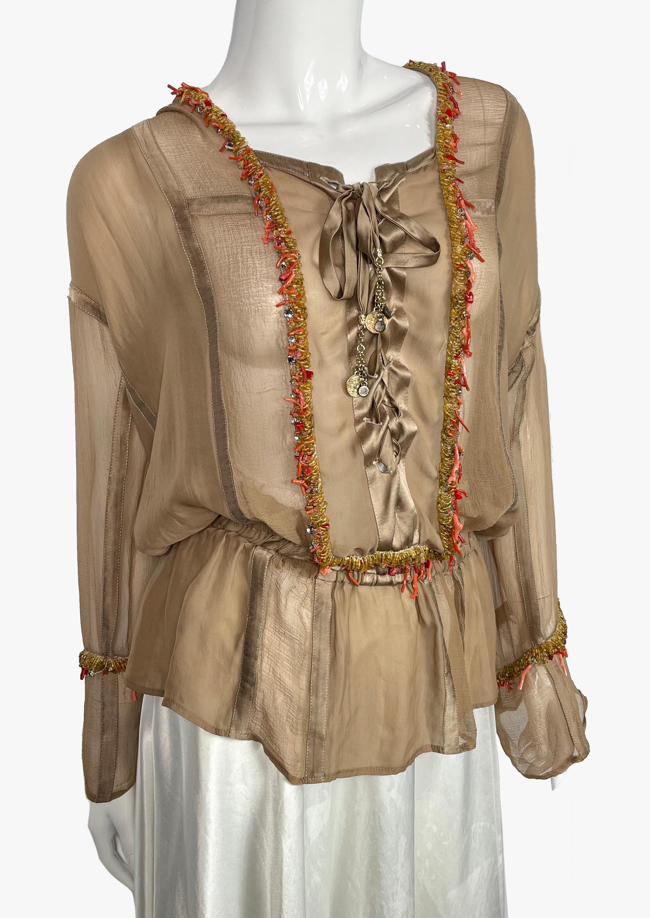 Silk blouse by Roberto Cavalli decorated with corals and beads. 
Tied at the chest with a silk ribbon. 
Elasticated waist.
Size: XS but will fit S-M
Total length - 71 cm / 28''
Sleeve - 71 cm / 28''
Waist - 70 cm / 27,5''
Composition: 100%