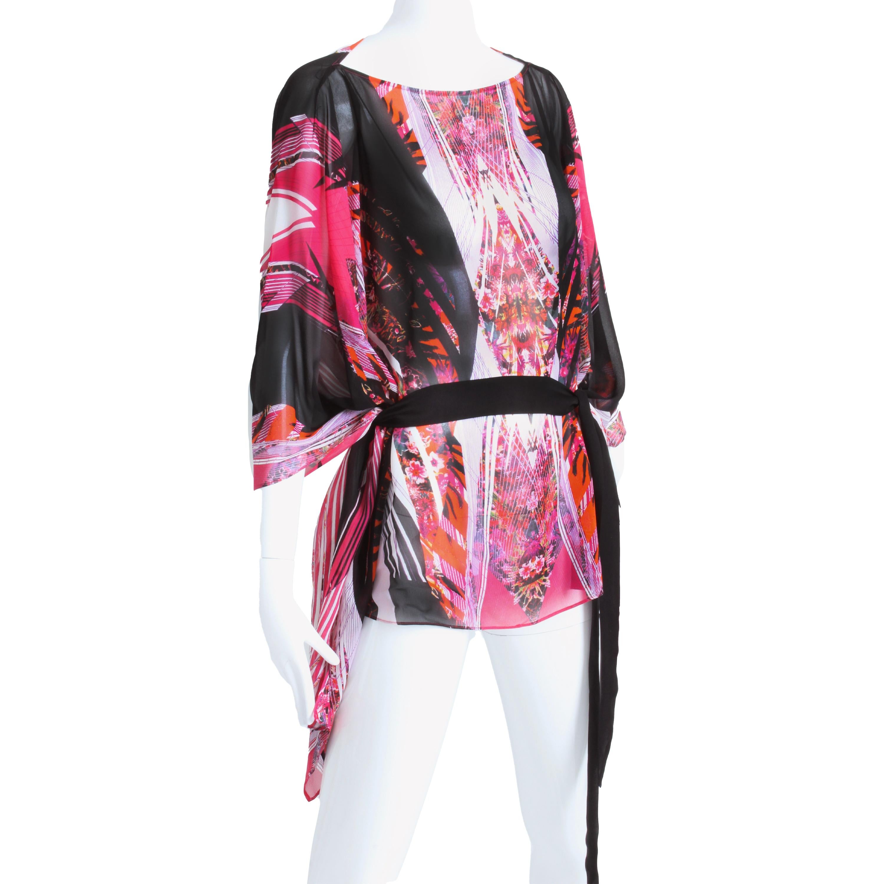 We love this vintage Roberto Cavalli silk caftan style blouse with belt, likely made in the early 2000s.  Made from a gorgeous silk chiffon fabric, it features a colorful abstract print in shades of pink, black and white.  Sheer and luxe, it comes
