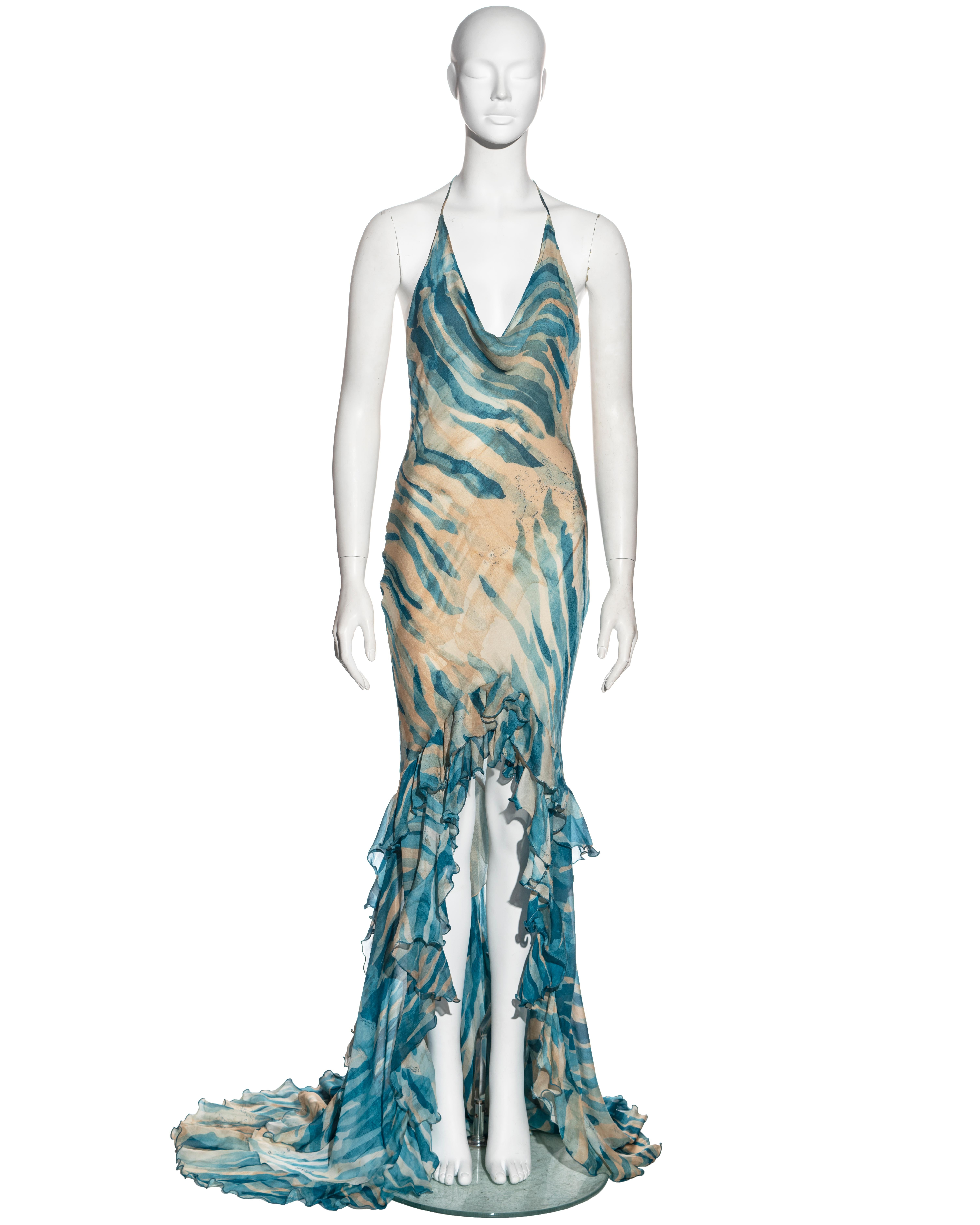 ▪ Roberto Cavalli evening dress 
▪ Sold by One of a Kind Archive
▪ Constructed from double-layered silk chiffon with a nude and blue painted stripe print 
▪ Halter-neck string ties with gold chain and coin charms 
▪ Cowl neck
▪ High-low ruffled