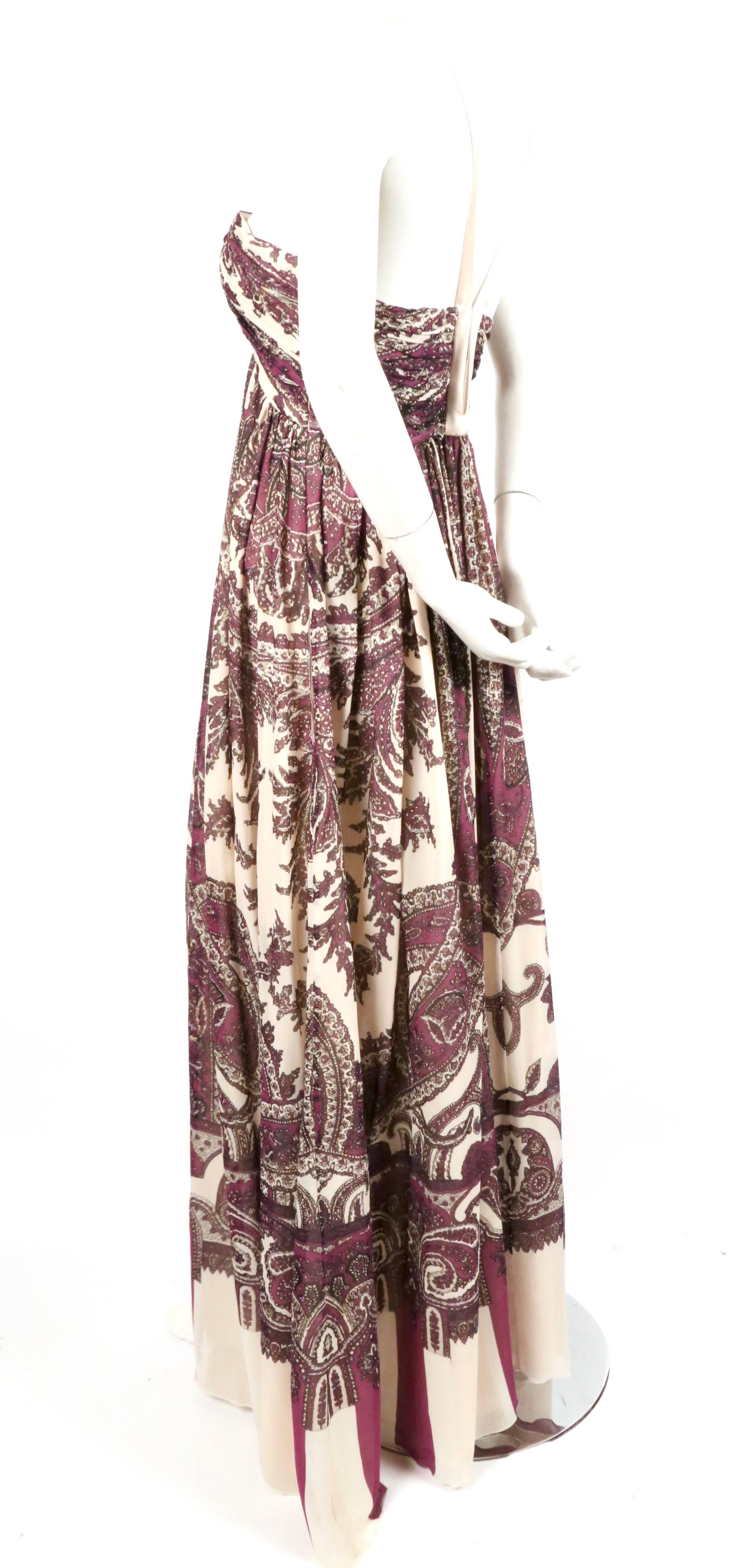 Paisley printed silk chiffon gown with satin straps from Roberto Cavalli. Colors are purple, black and a light blush shade with gold metallic shades throughout. Labeled an Italian size 44 however this dress runs small and will best fits a US 4 or 6.