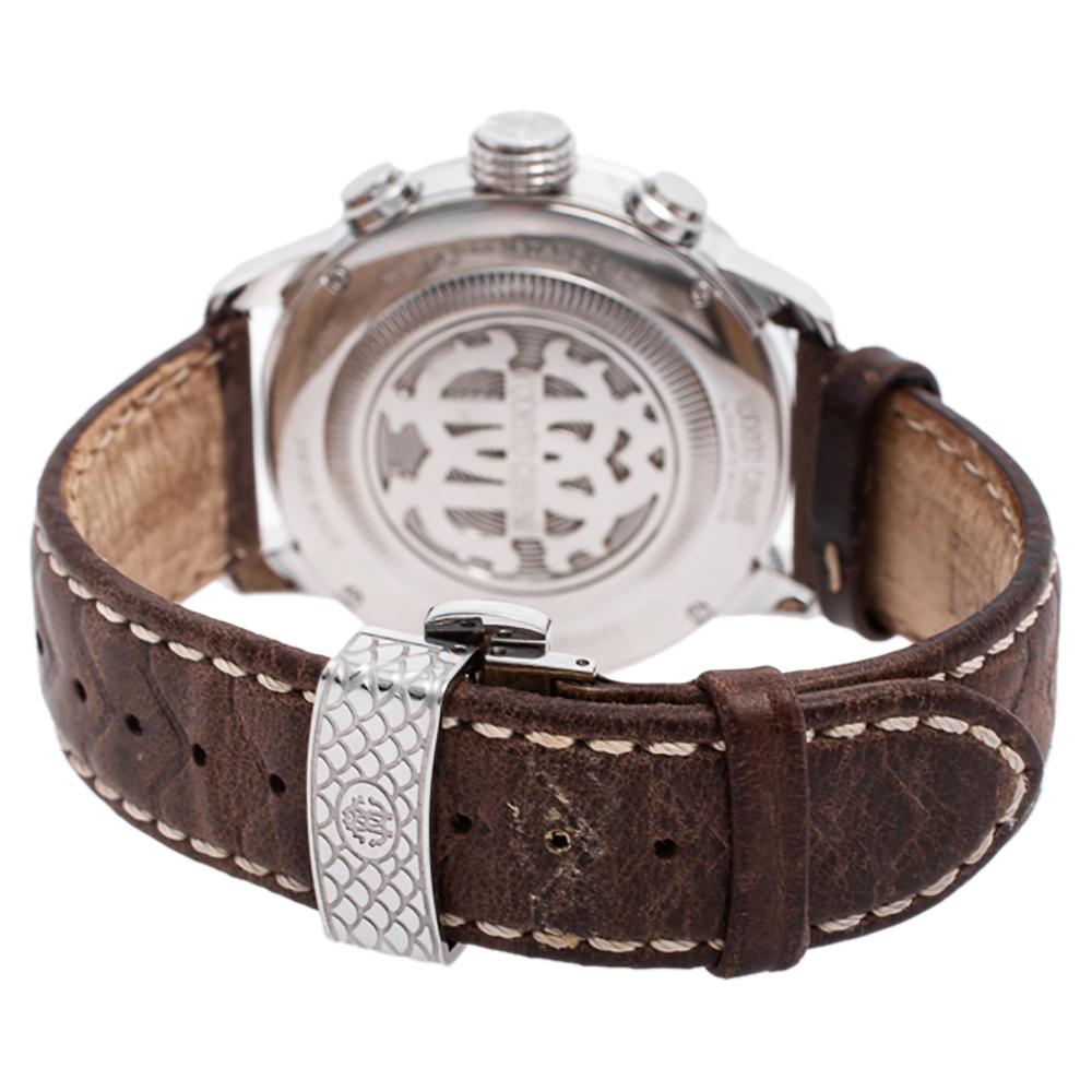 This Roberto Cavalli watch features a stainless steel case and an engraved bezel. The silver dial carries a textured surface with hour markers, three hands, a date window, and three subdials. Designed to be ideal for everyday use, the quartz watch
