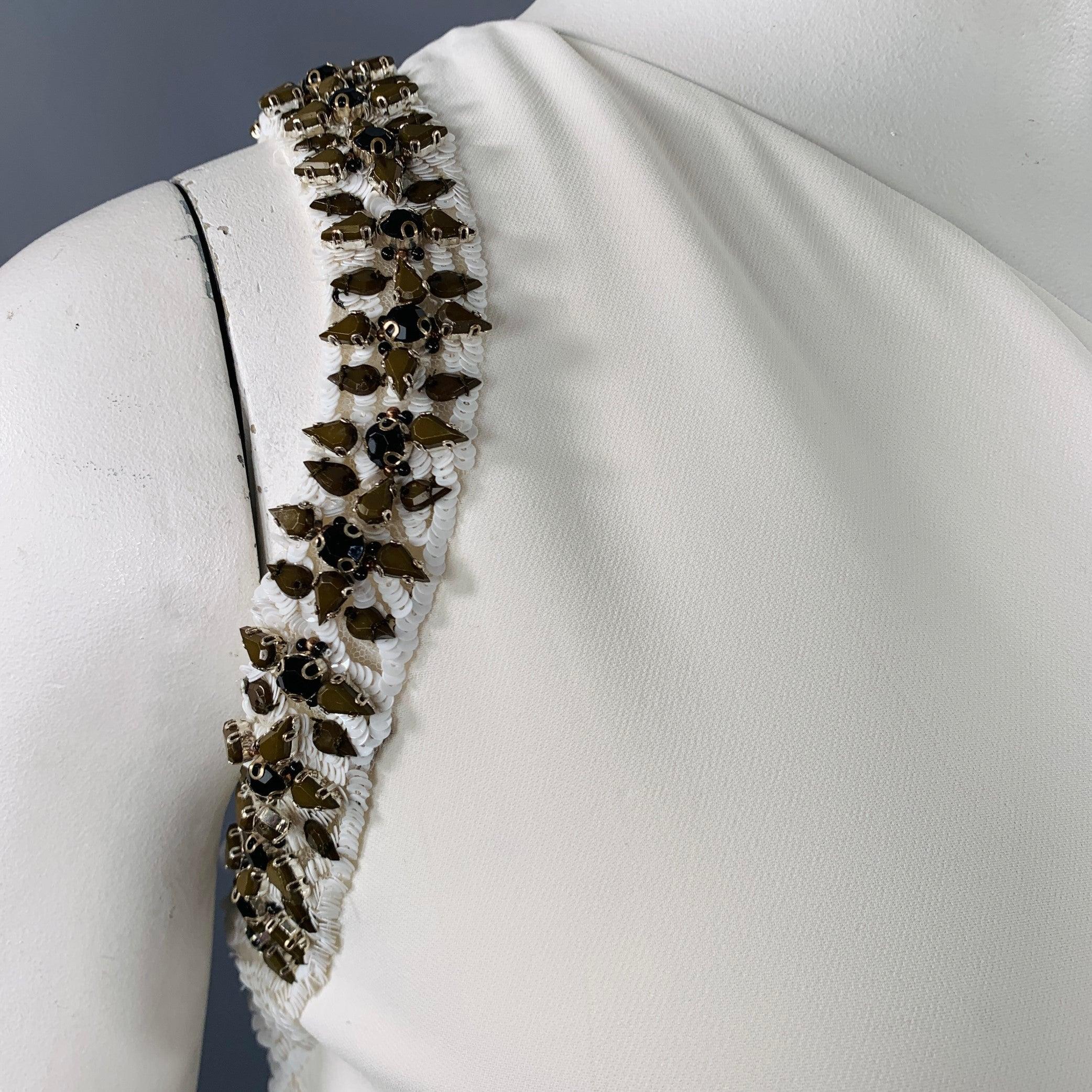ROBERTO CAVALLI gown
in a stretchy cream viscose blend fabric featuring a one shoulder style, rhinestone studded trim cutouts, and invisible side zipper closure. Made in Italy. Note: this garment has been professionally altered. Please double check