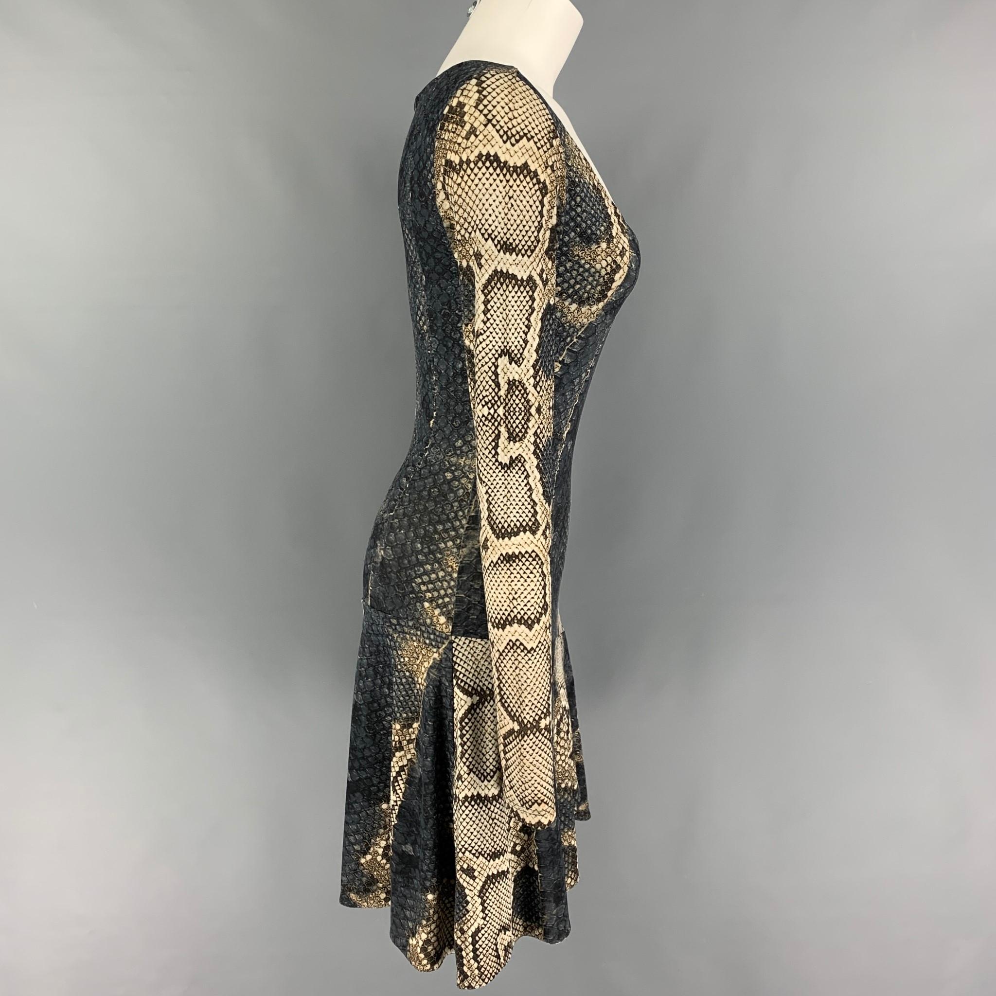 ROBERTO CAVALLI dress comes in a brown & beige snake skin print polyamide / elastane featuring long sleeves, a-line style, and a deep v-neck. Made in Italy. 

Very Good Pre-Owned Condition.
Marked: 38

Measurements:

Shoulder: 14.5 in.
Bust: 29