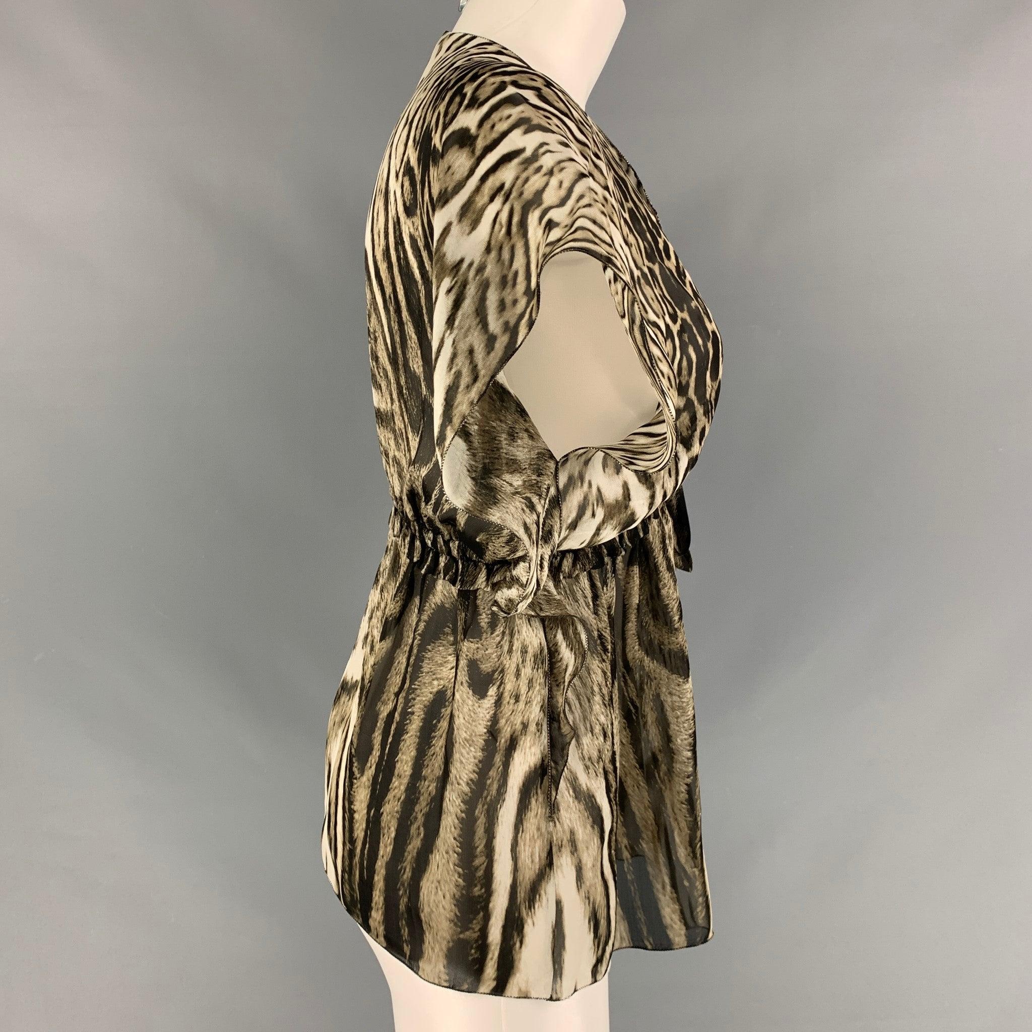 ROBERTO CAVALLI sleeveless blouse comes in olive and black animal print silk fabric featuring 
 a v- neck and draw string detail at bust. Made in Italy.New With Tags. 
 

 Marked:  38 
 

 Measurements: 
  
 Shoulder: 15 inches Bust: 36 inches