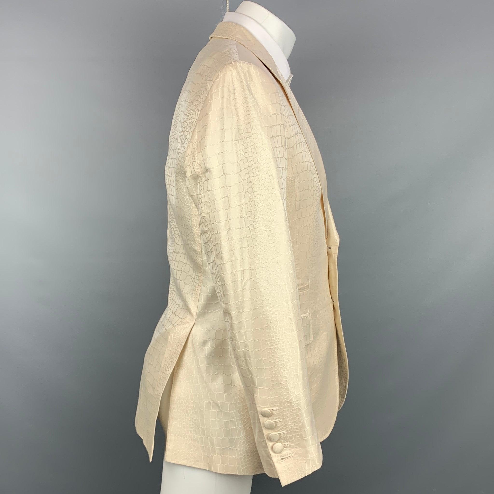 ROBERTO CAVALLI sport coat in a beige animal print silk with a full liner featuring a notch lapel, flap pockets, and a two covered button closure. Made in Italy.
Very Good
Pre-Owned Condition. Faint marking at front.  

Marked:   IT 50 