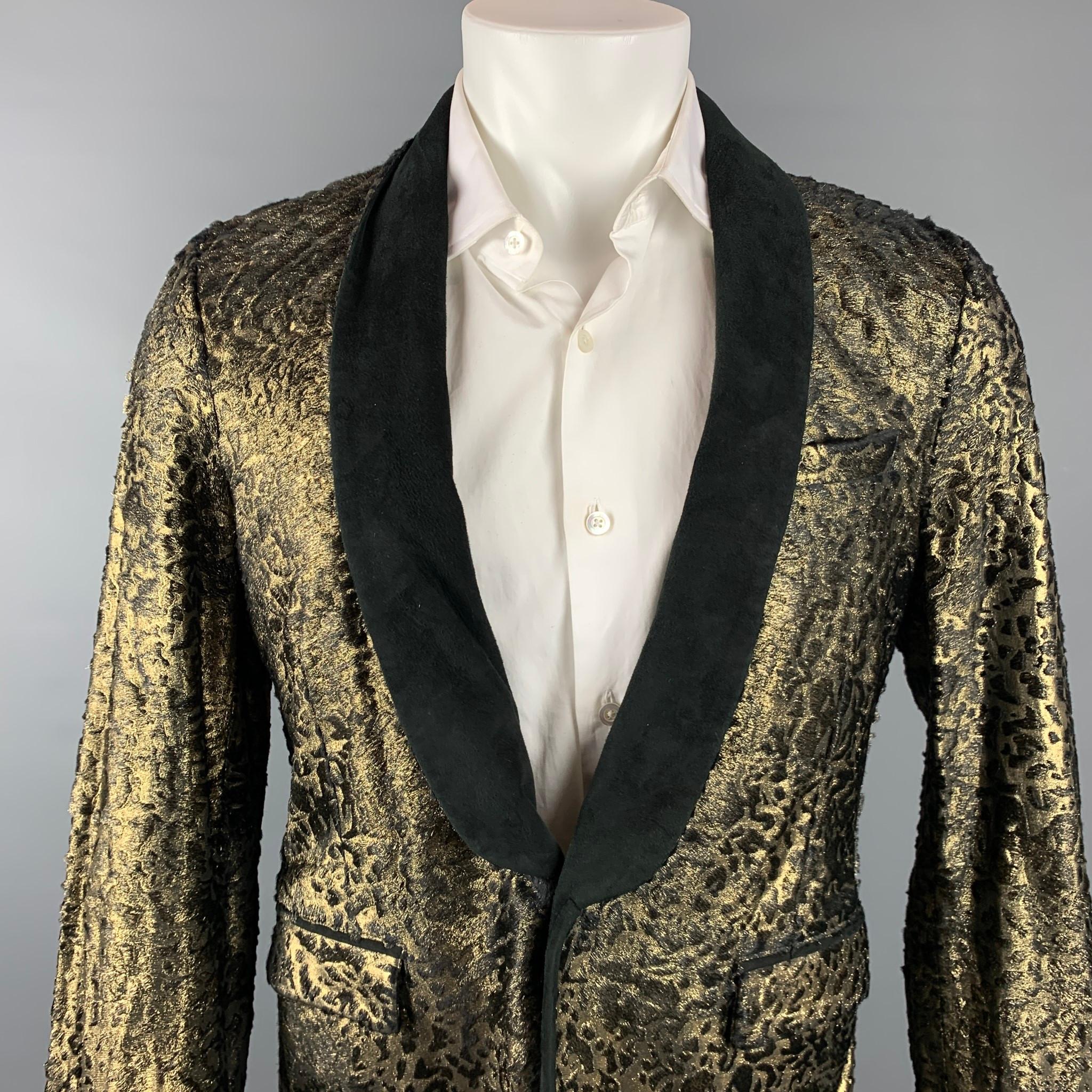 ROBERTO CAVALLI sport coat comes in a gold laser cut pony hair jacquard material with a full liner featuring a black suede lapel, flap pockets, and a single button closure. Made in Italy.

New With Tags.
Marked: IT 52
Original Retail Price: