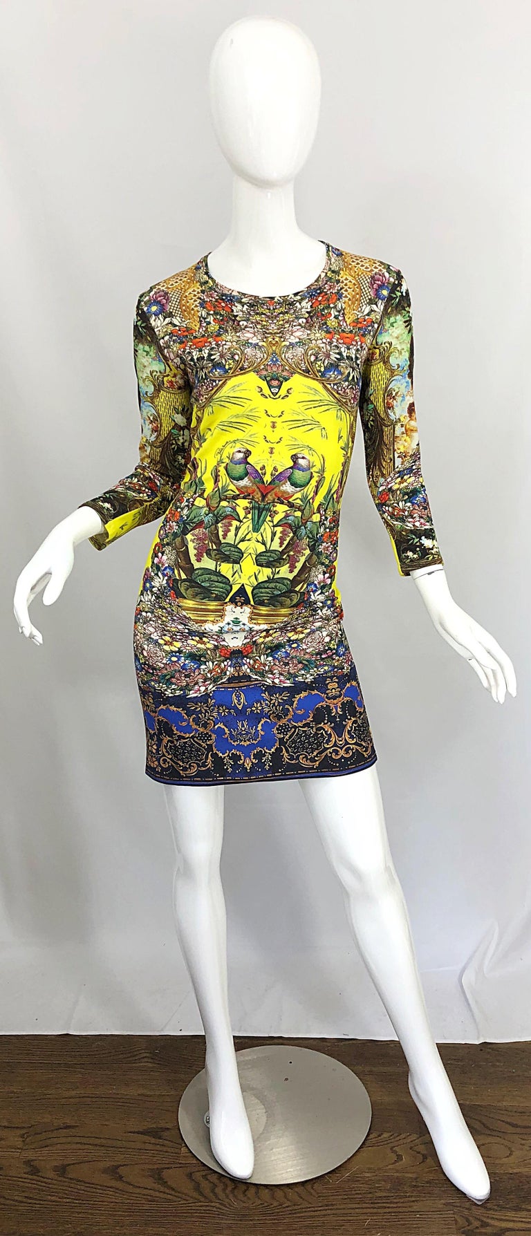 Incredible ROBERTO CAVALLI early 2000s bright yellow Plato novelty print 3/4 sleeve rayon jersey dress! Features flowers and bids printed throughout. Simply slips over the head, and stretches to fit. Can easily be worn day or evening. Perfect with