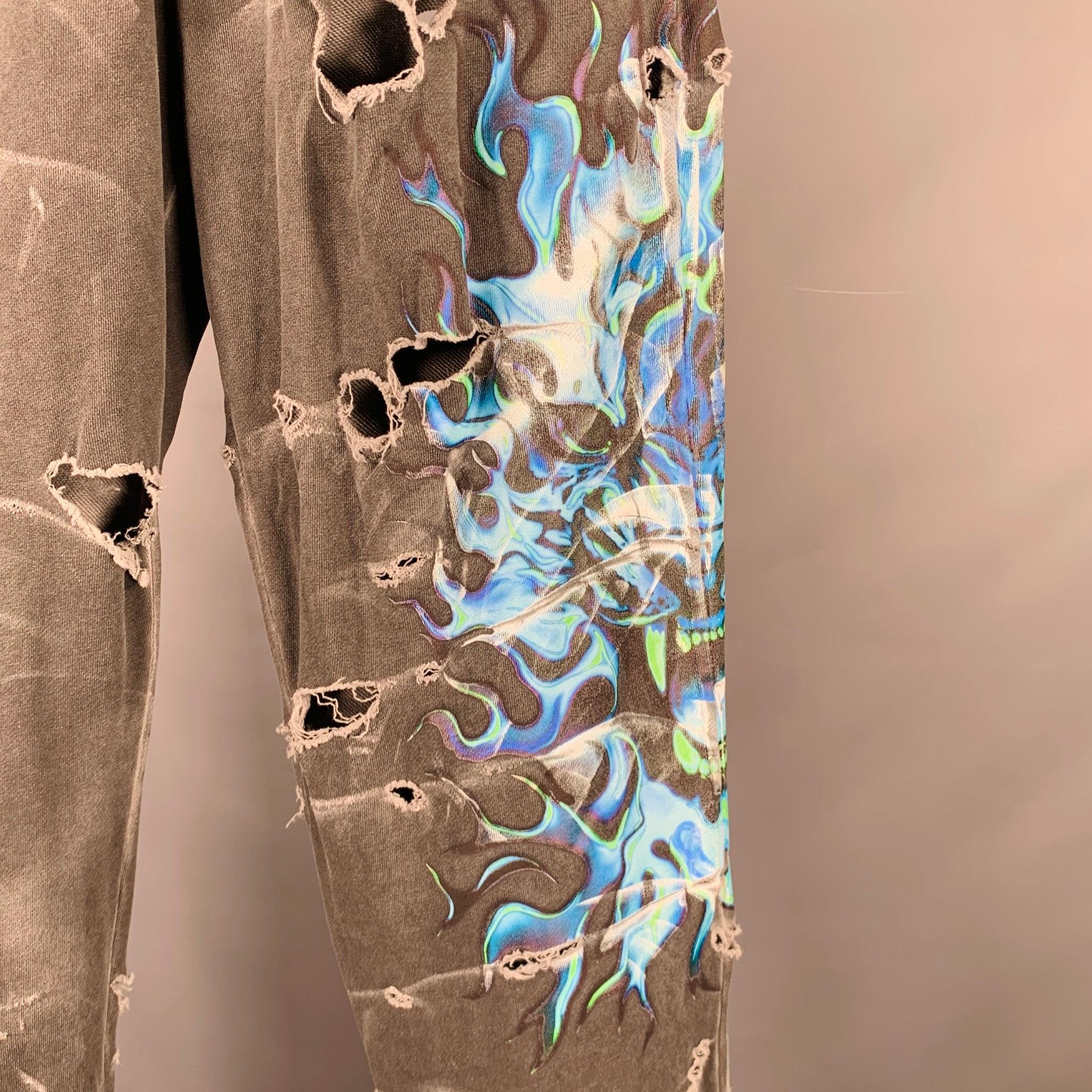 ROBERTO CAVALLI casual lounge pants
in a grey and blue cotton knit featuring a distressed style, blue flame design, and zip fly closure.
Made in Italy.Excellent Pre-Owned Condition. 

Marked:   M 

Measurements: 
  Waist: 32 inches Rise: 13.5 inches