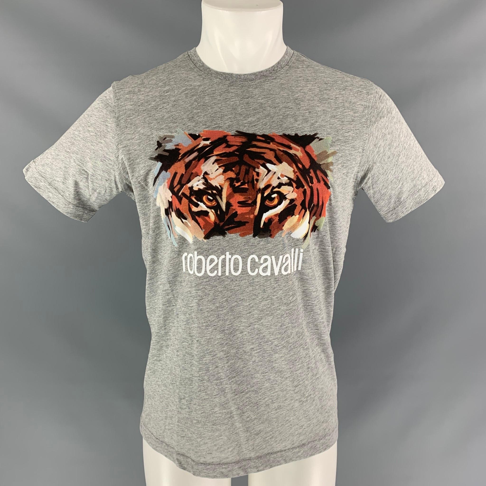 ROBERTO CAVALLI short sleeve t-shirt comes in heather grey cotton, artistic tiger eyes graphic art at center front and a round collar.

New with Tag.
Marked: M

Measurements:

Shoulder: 18 in
Chest: 43 in
Sleeve: 8 in
Length: 28 in