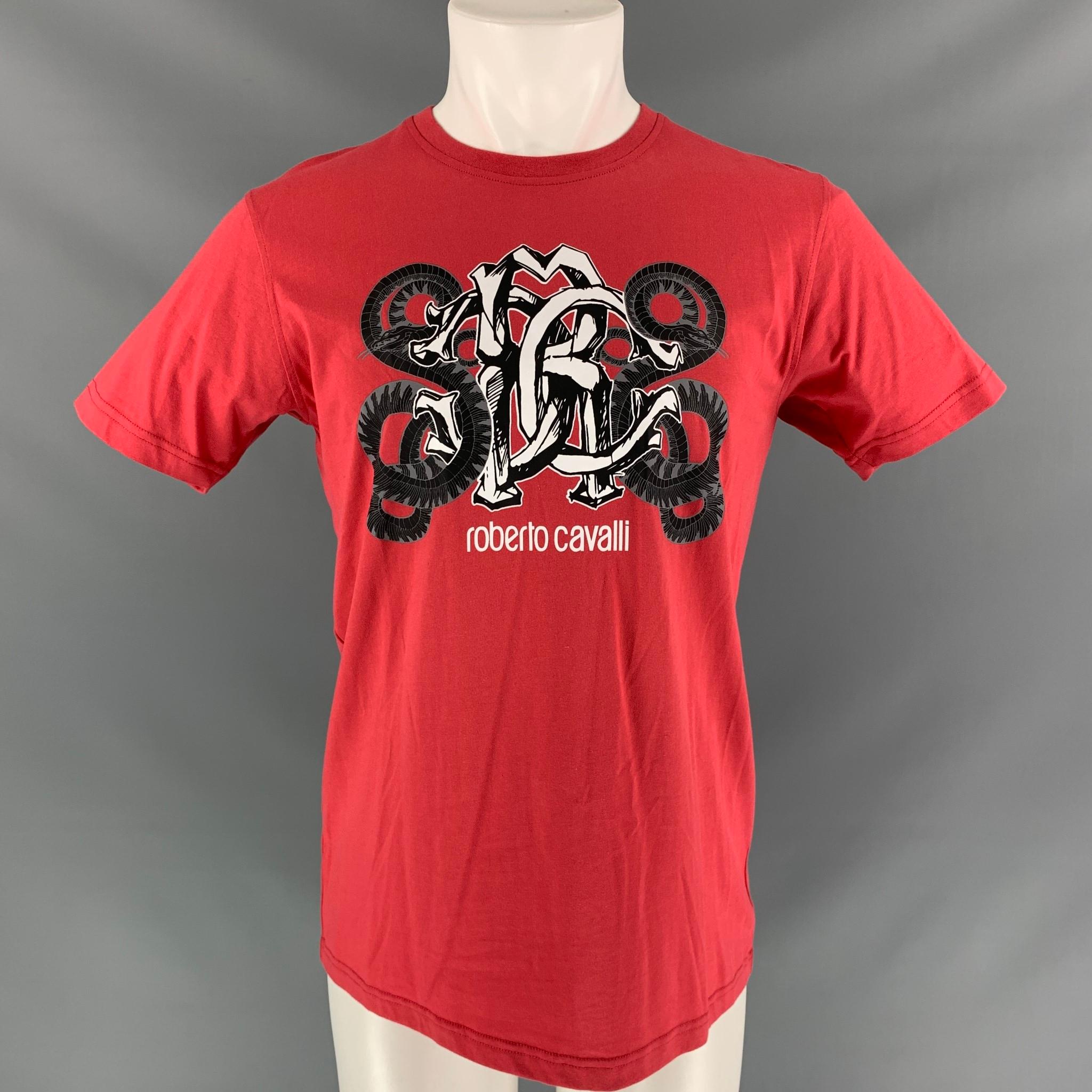 ROBERTO CAVALLI short sleeve t-shirt comes in coral red cotton, black, white and grey snakes logo graphic art at center front and a round collar.

New with Tag.
Marked: M

Measurements:

Shoulder: 18 in
Chest: 43 in
Sleeve: 8 in
Length: 28 in