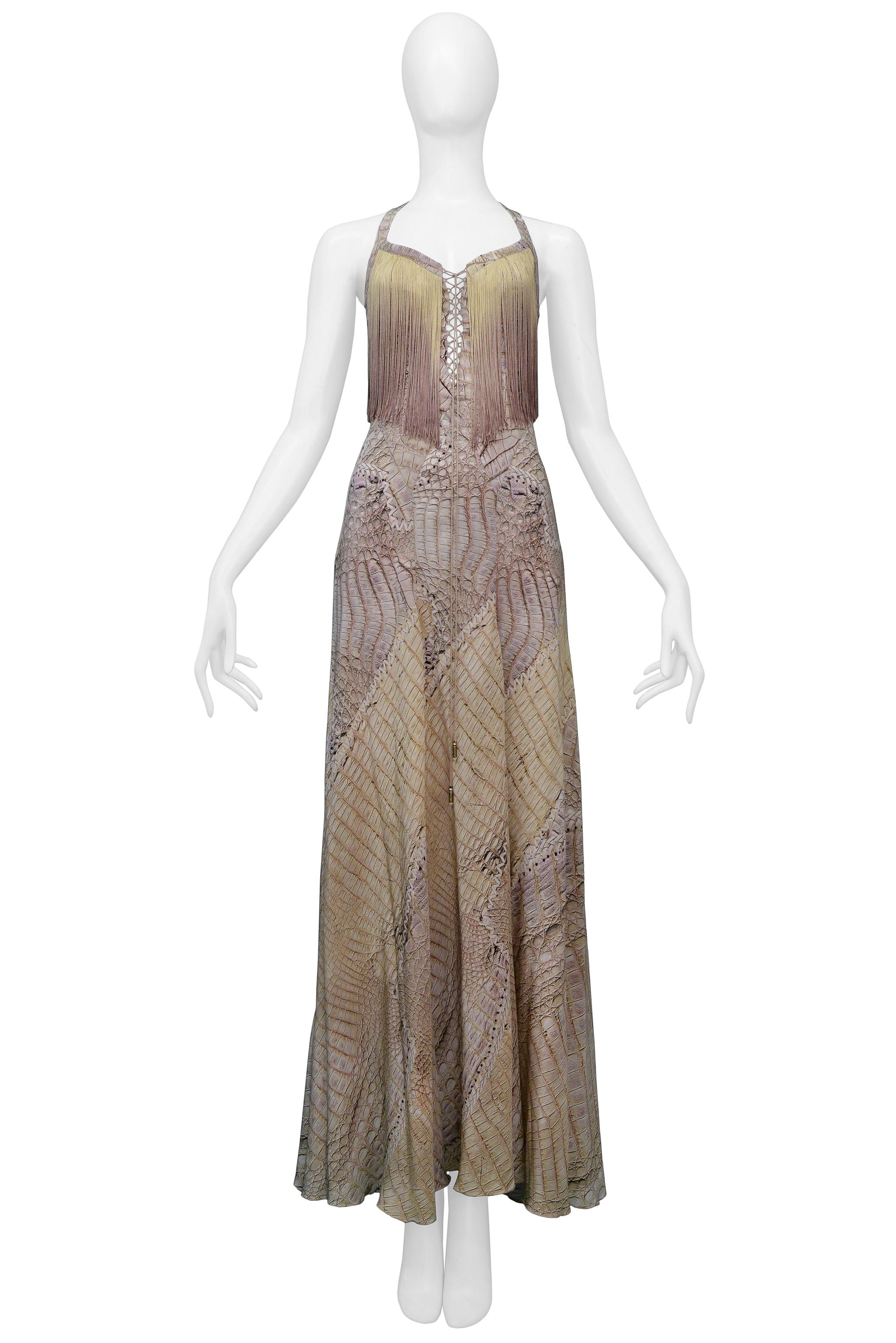 Resurrection Vintage is excited to present a vintage Roberto Cavalli earth-tone evening gown featuring an open neckline, straps, snake print, racerback with corset detail, multicolor ombre fringe, and gown length. 

Roberto Cavalli
Size