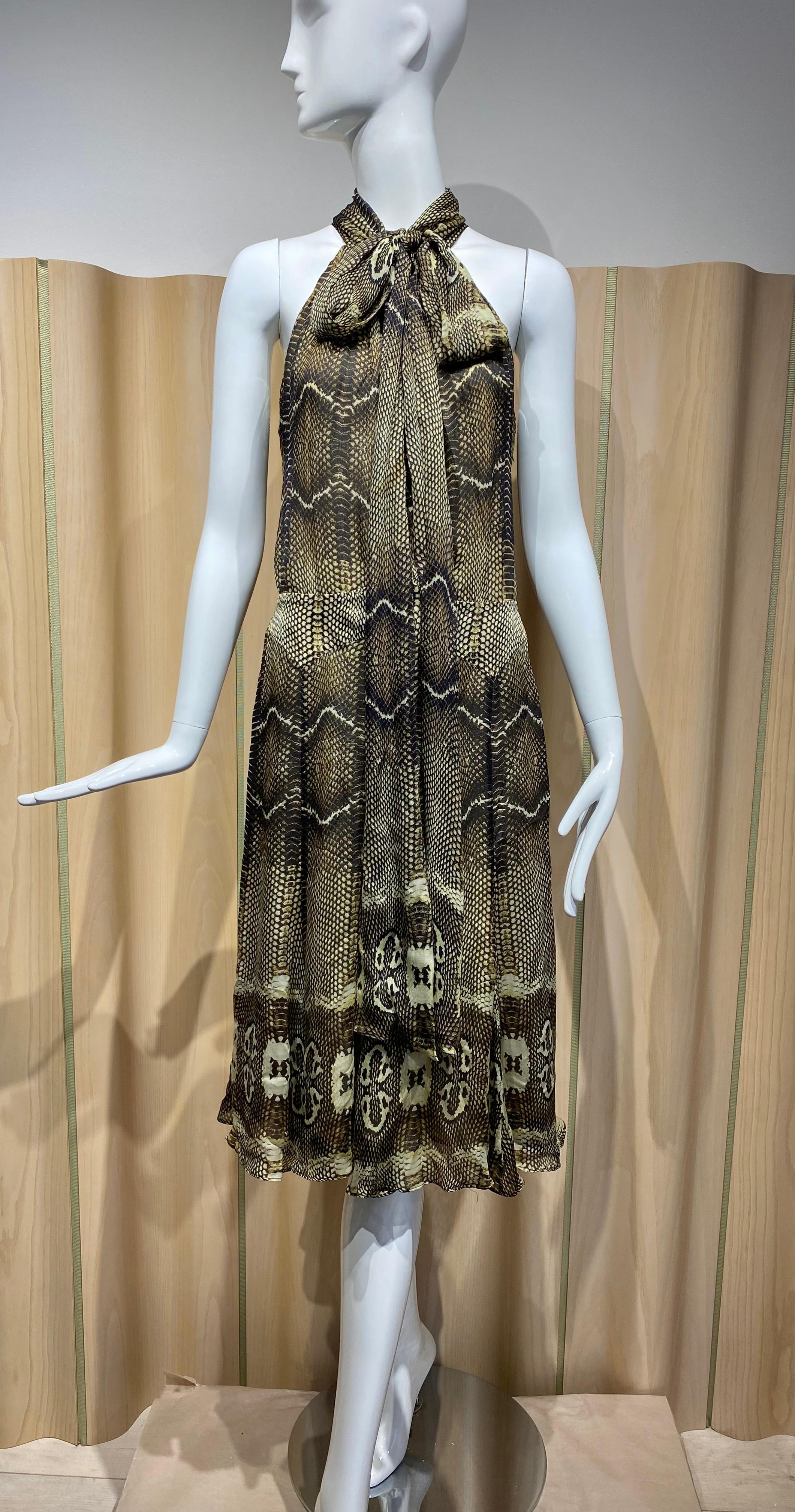 2000s Roberto Cavalli Silk Chiffon snake skin print sleeveless  knee length dress with long sash on collar.
fit size medium
