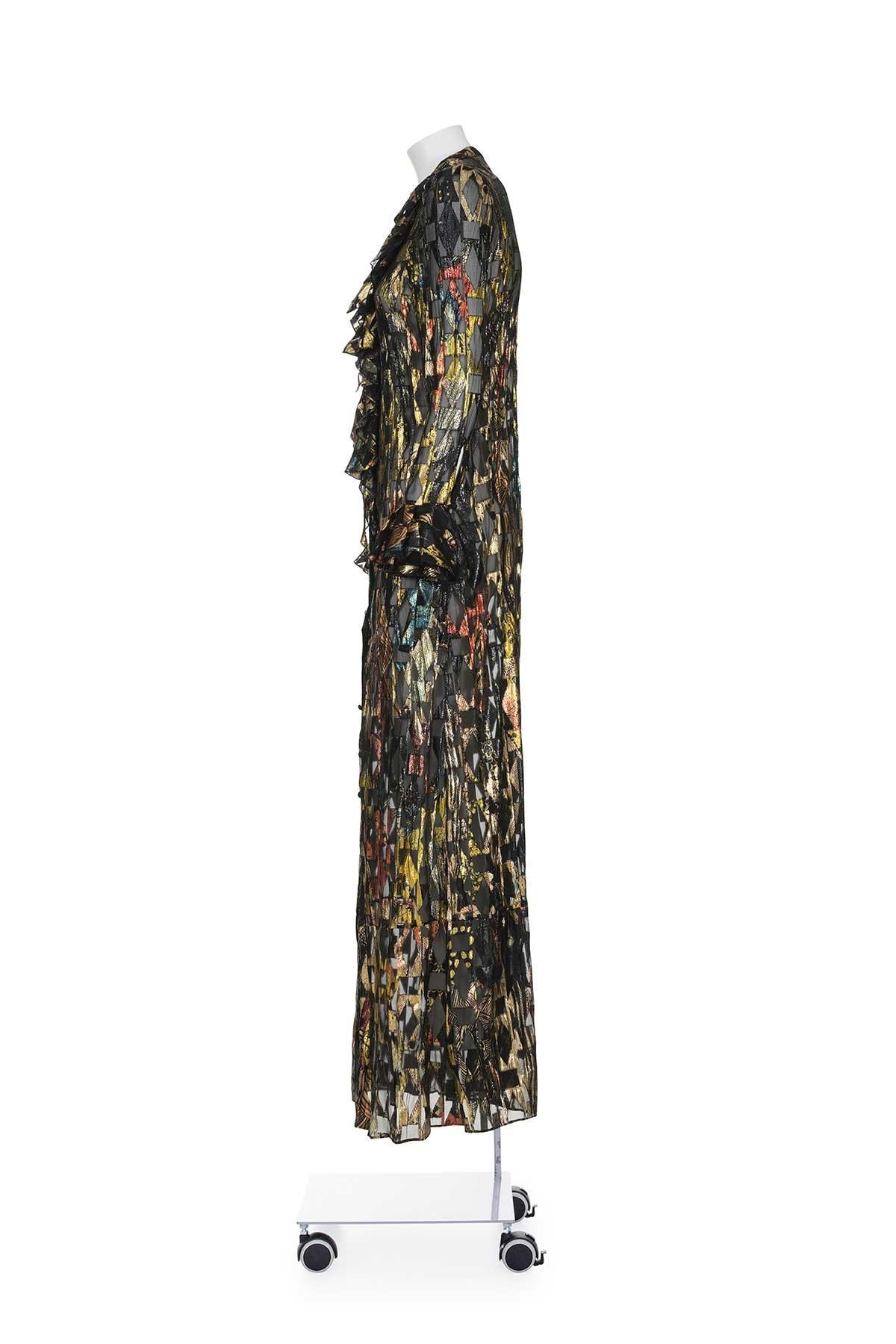Spring Summer 2016 lurex ruffled long sleeve long dress by Roberto Cavalli.
Front slit.
The composition is 56% silk and 44% polyester.
