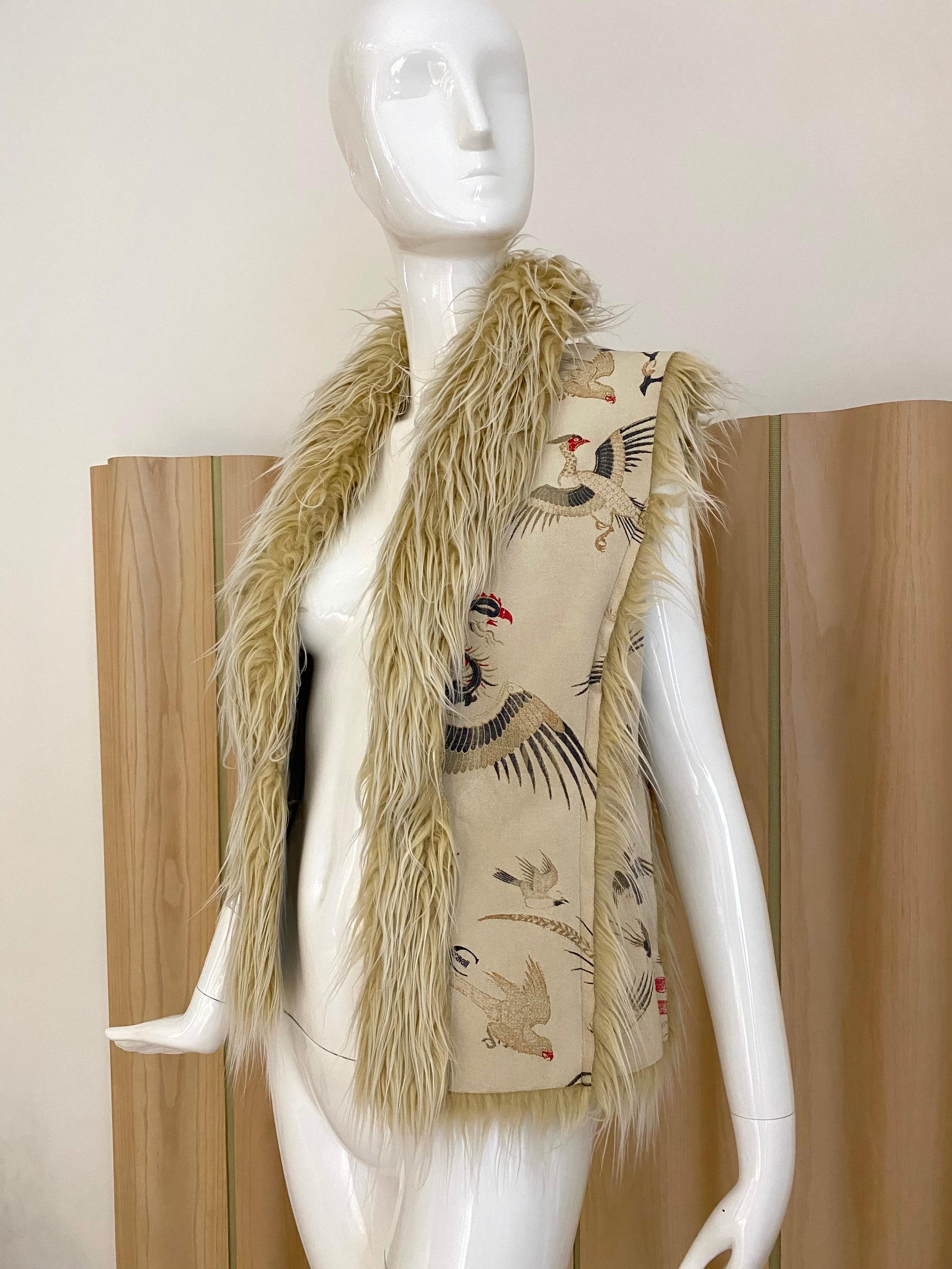 Roberto cavalli embroidered  suede vest with faux fur. Very chic.
marked IT size 42 . fit size 4/6 
Bust : 34-36 “
Excellent condition 