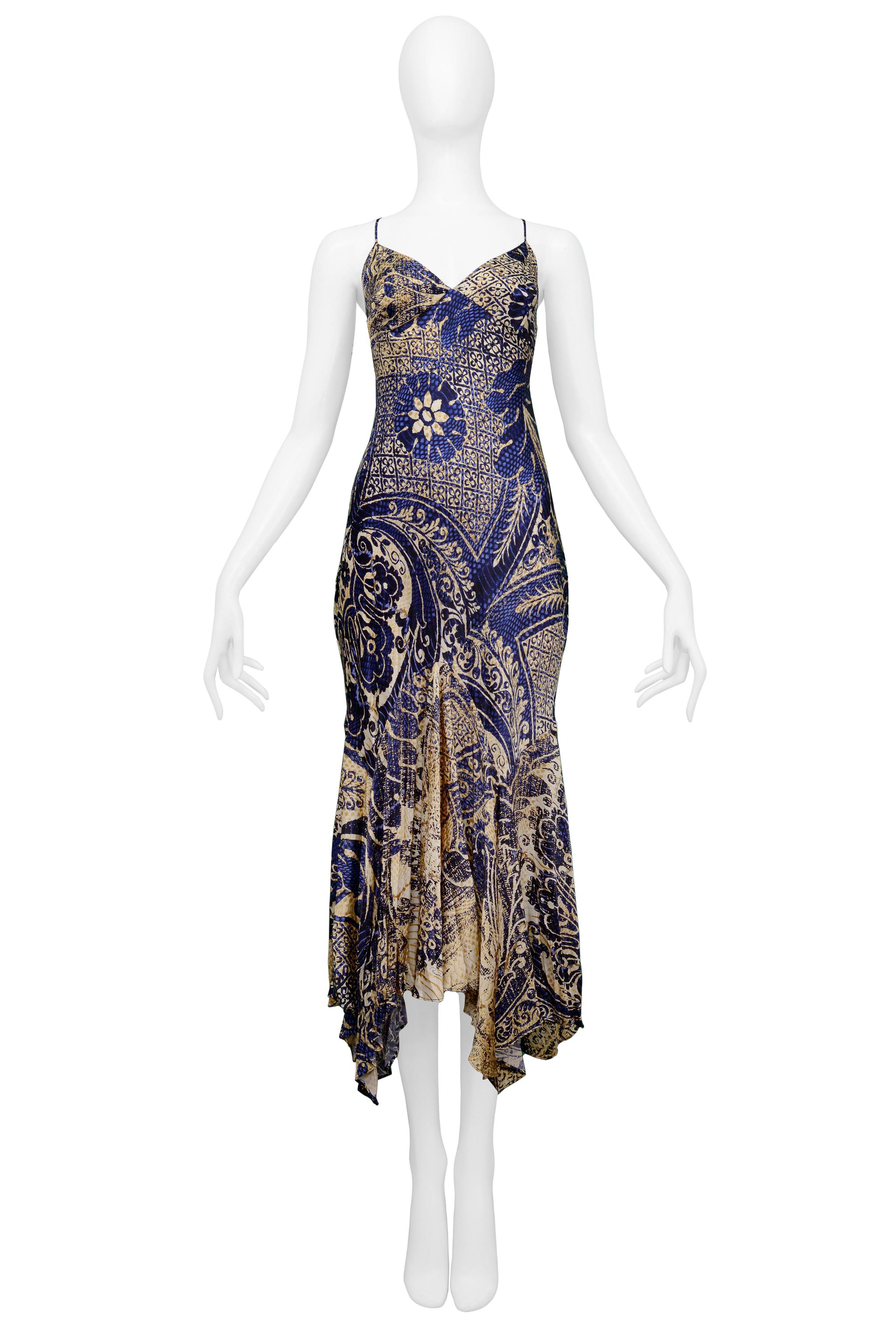 Resurrection Vintage is excited to present a vintage Roberto Cavalli tan dress with a decorative navy print featuring thin straps, a slip dress style bodice, and a flared hem. 

Roberto Cavalli
Size: 44
Silk
Excellent Vintage Condition 
Authenticity
