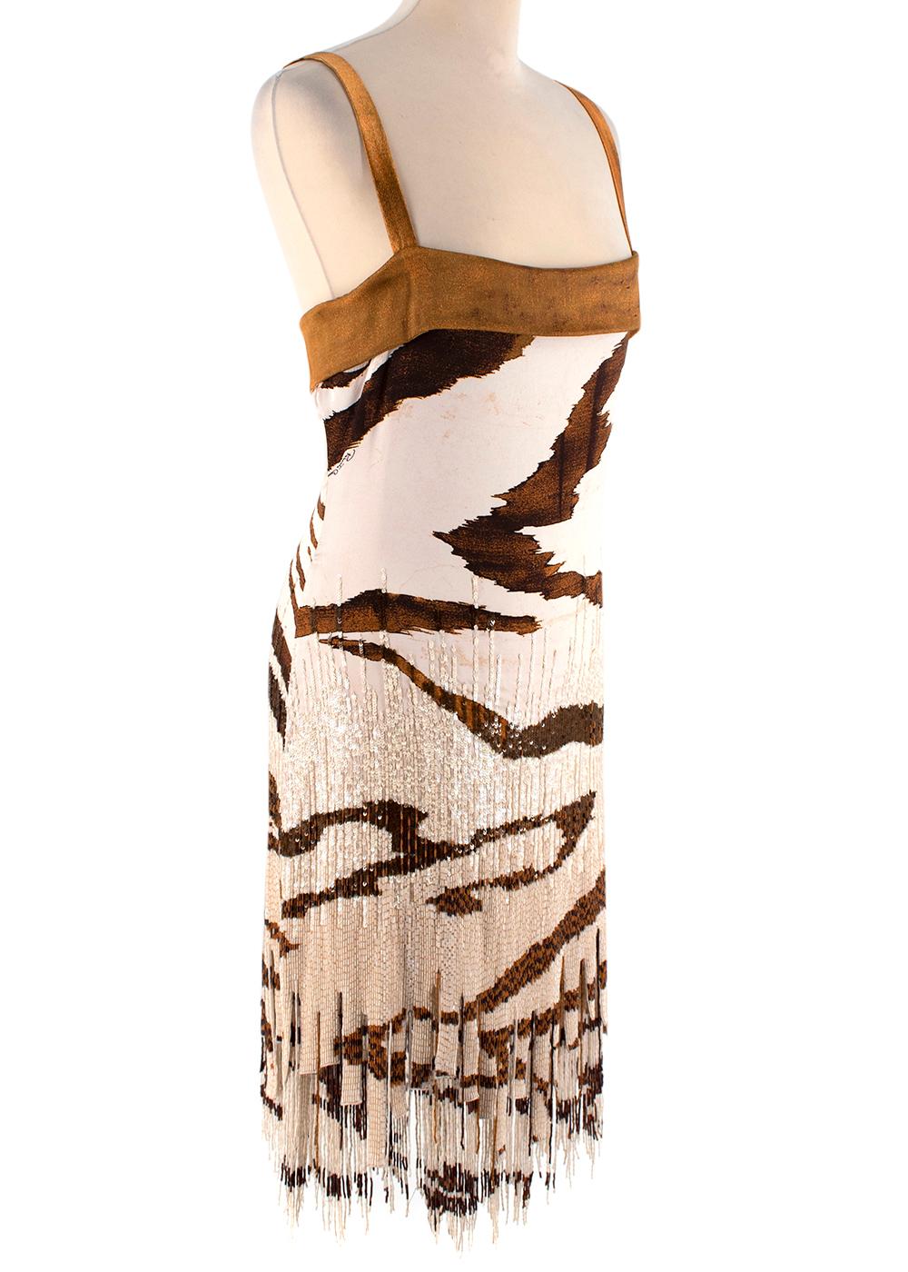 Roberto Cavalli Tiger Print Beaded Sequin Silk Dress

- Print imitating a tiger print
- Heavily embellished with beaded sequins
- Fully lined
- Concealed zip closure at the back
- Mix of beige, brown and nude tones

Materials:
93% Silk
7%