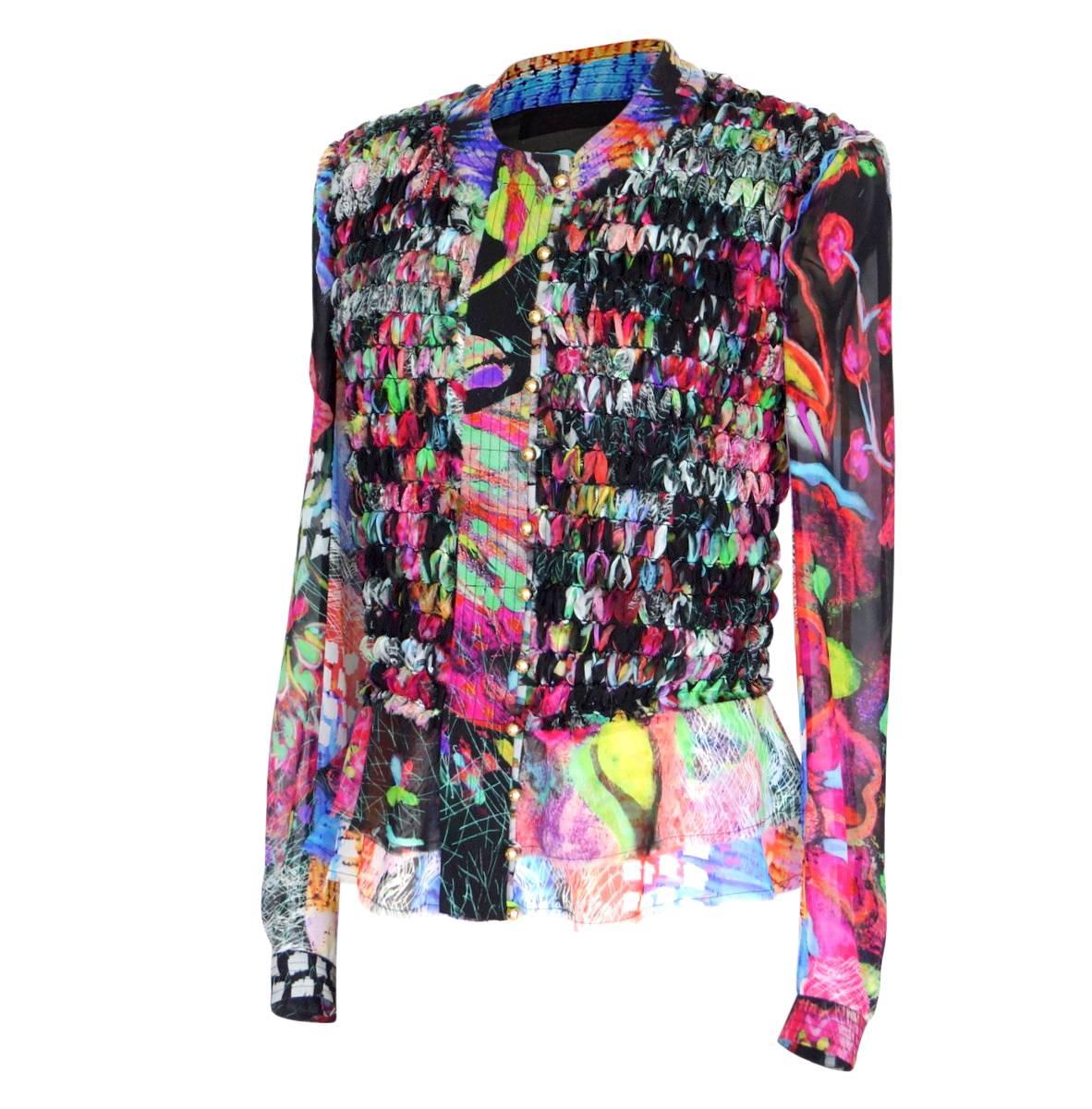 Mightychic offers a guaranteed authentic Roberto Cavalli lush floral and abstract print in black, blue, pinks, magenta, green and soft grey. 
12 small round gold buttons.  All logo embossed. Loop closures. 
1 logo embossed button at each cuff.