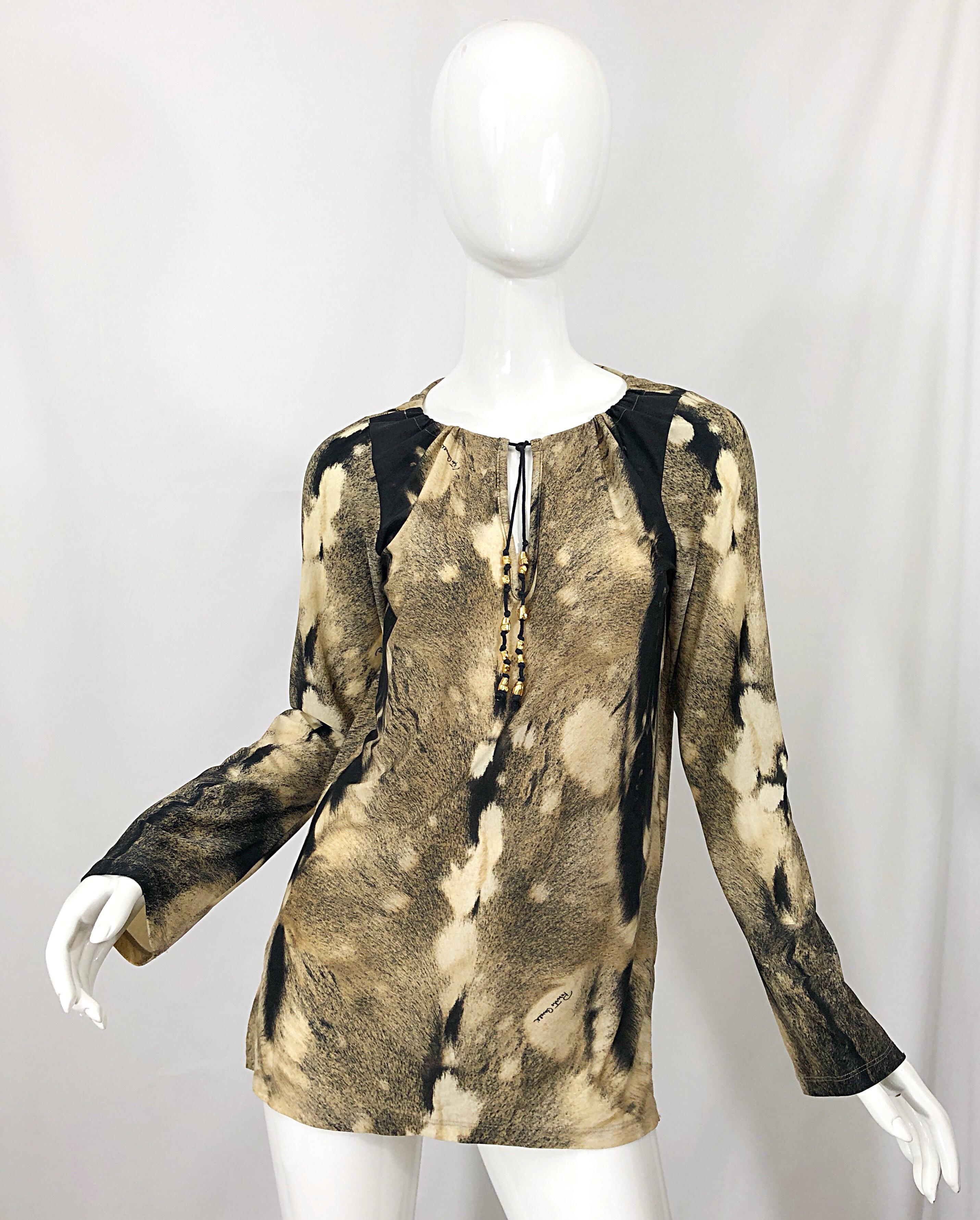Awesome vintage late 1990s ROBERTO CAVALLI trompe l'oeil faux fur print brown and ivory tunic shirt! Features a warm brown and ivory print throughout. Soft stretch jersey offers a flattering comfortable fit. Gold beaded tassels at center neck. Side