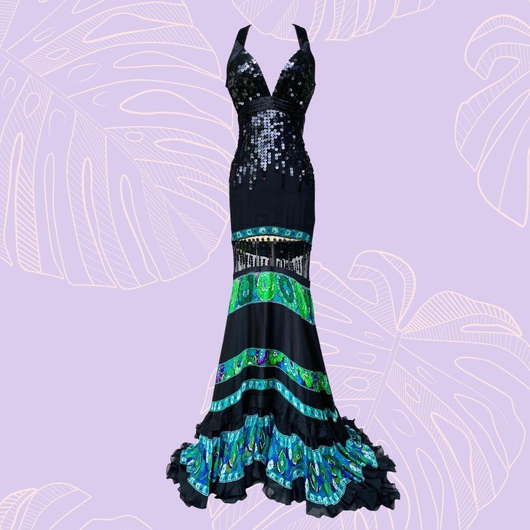 Roberto Cavalli - Vibrant black sequin evening gown. Dramatic, colorful and fun best describes this gown.  The upper part of the dress is sheer with black sequin overlay. The fit is formed to the body with a colorful kick flared flounce at the