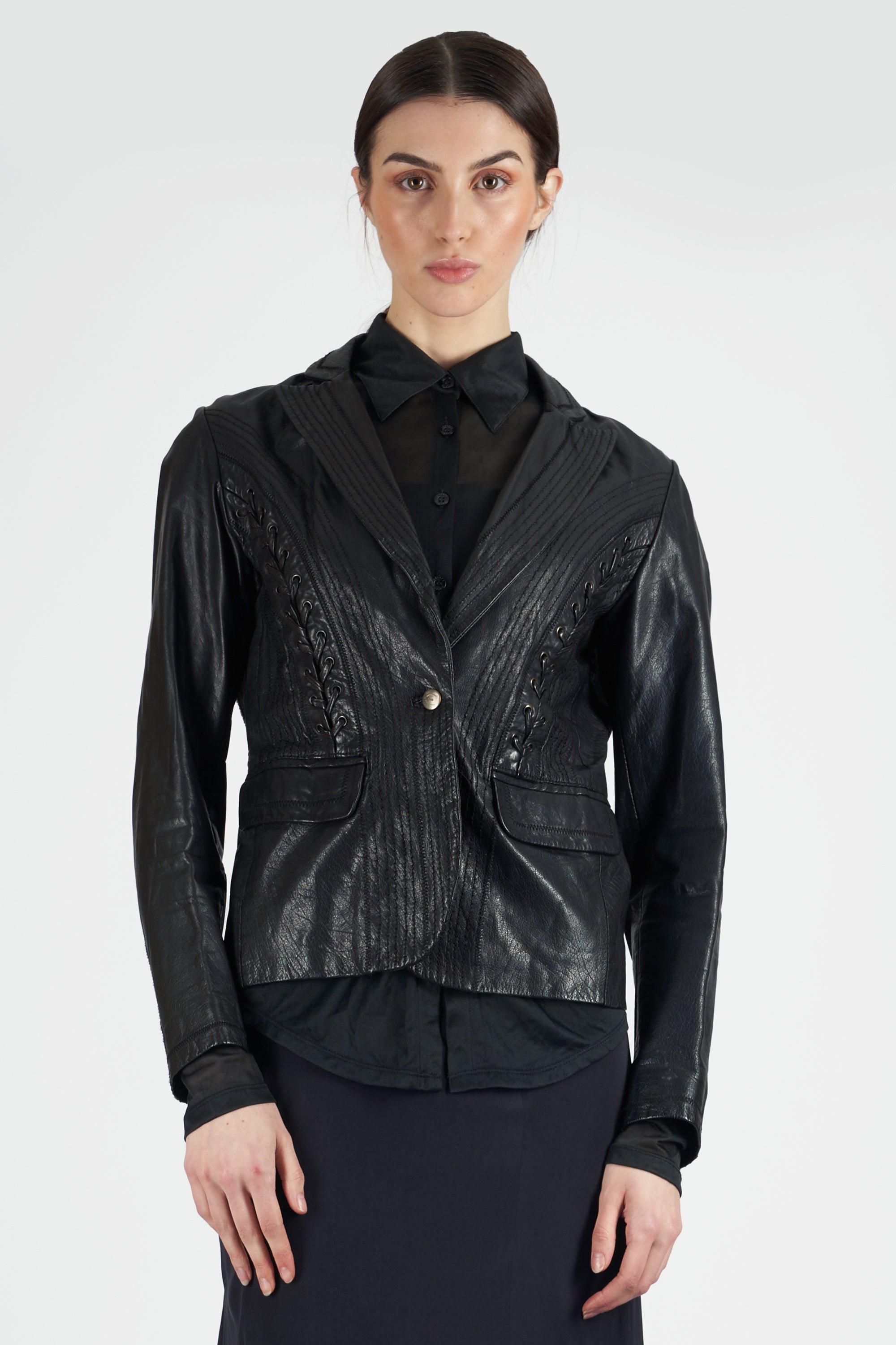 Nordic Poetry is excited to present this Just Cavalli 2000’s black leather jacket. Features pockets, button closure and lace up detail on the front and back. In excellent vintage condition. Authenticity guaranteed.

Label size: UK: 8
Modern size: