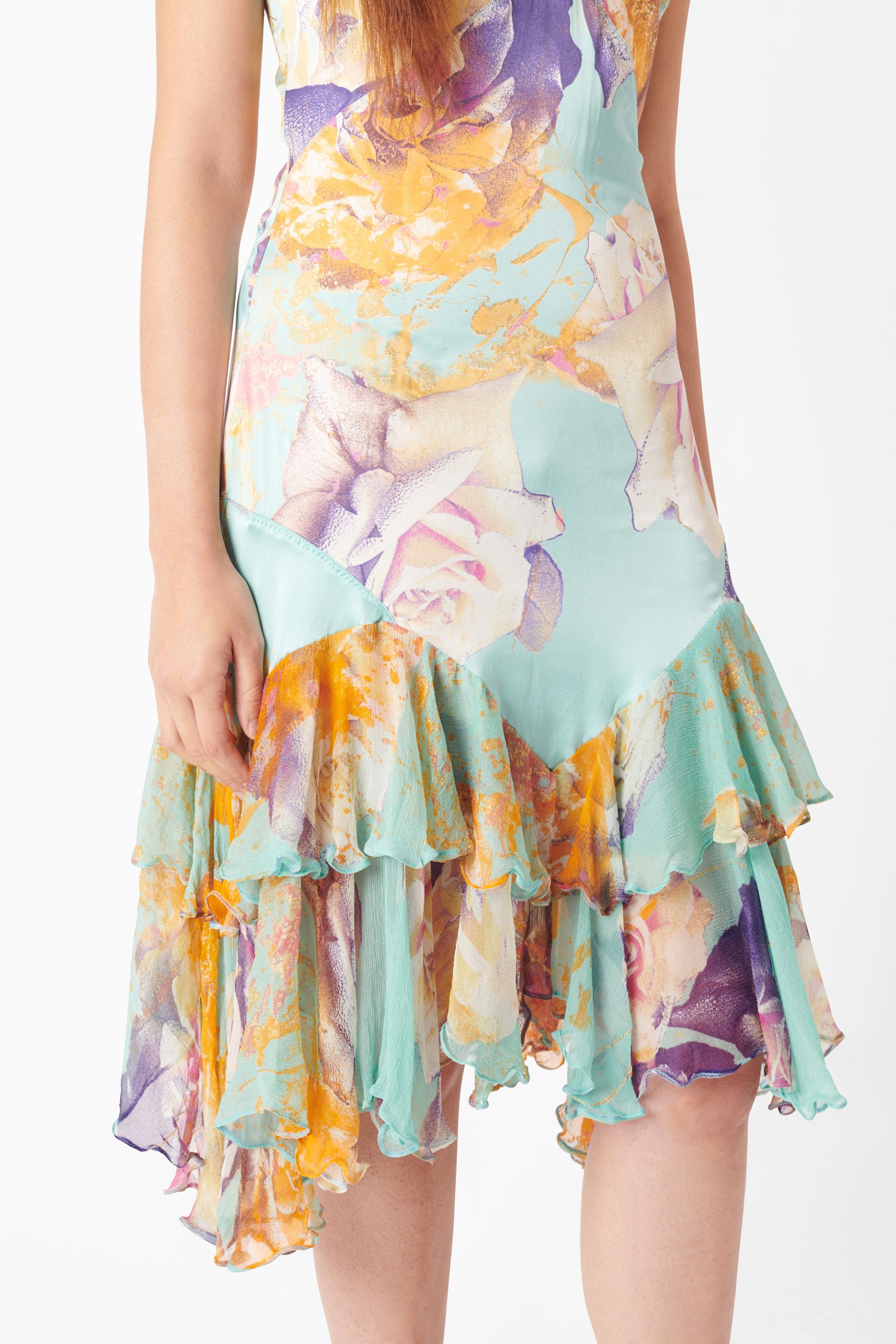 Vintage Roberto Cavalli 2004 printed blue multicolour floral silk midi dress. Features silk body with skinny straps, racerback style with silver hardware features and semi-sheer ruffles at the hem in a midi length with invisible zip closure. In