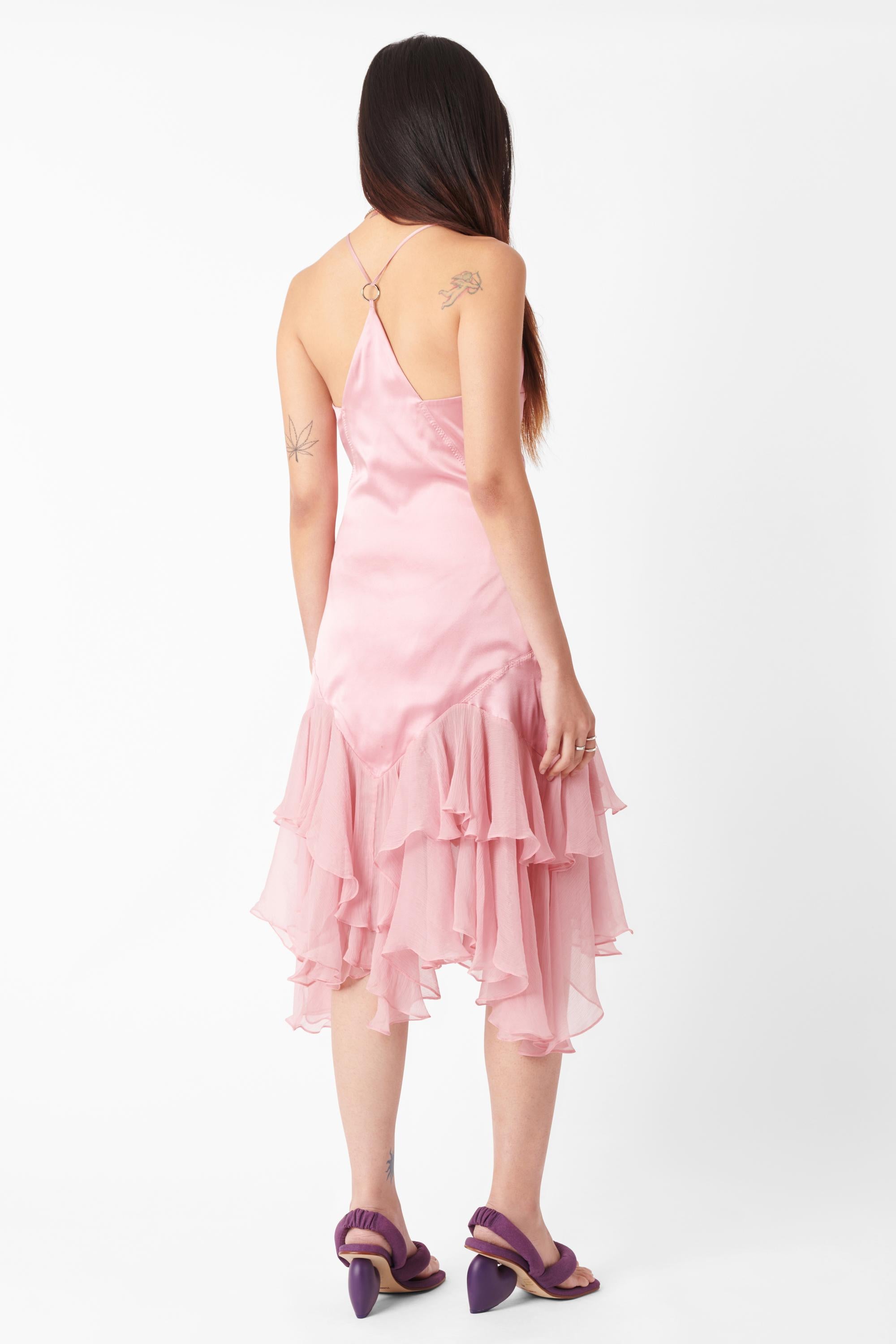 Vintage Roberto Cavalli 2004 pink silk midi dress. Features silk pink body with skinny straps, racerback style with silver hardware features and semi-sheer pink ruffles at the hem in a midi length with invisible zip closure. In excellent vintage