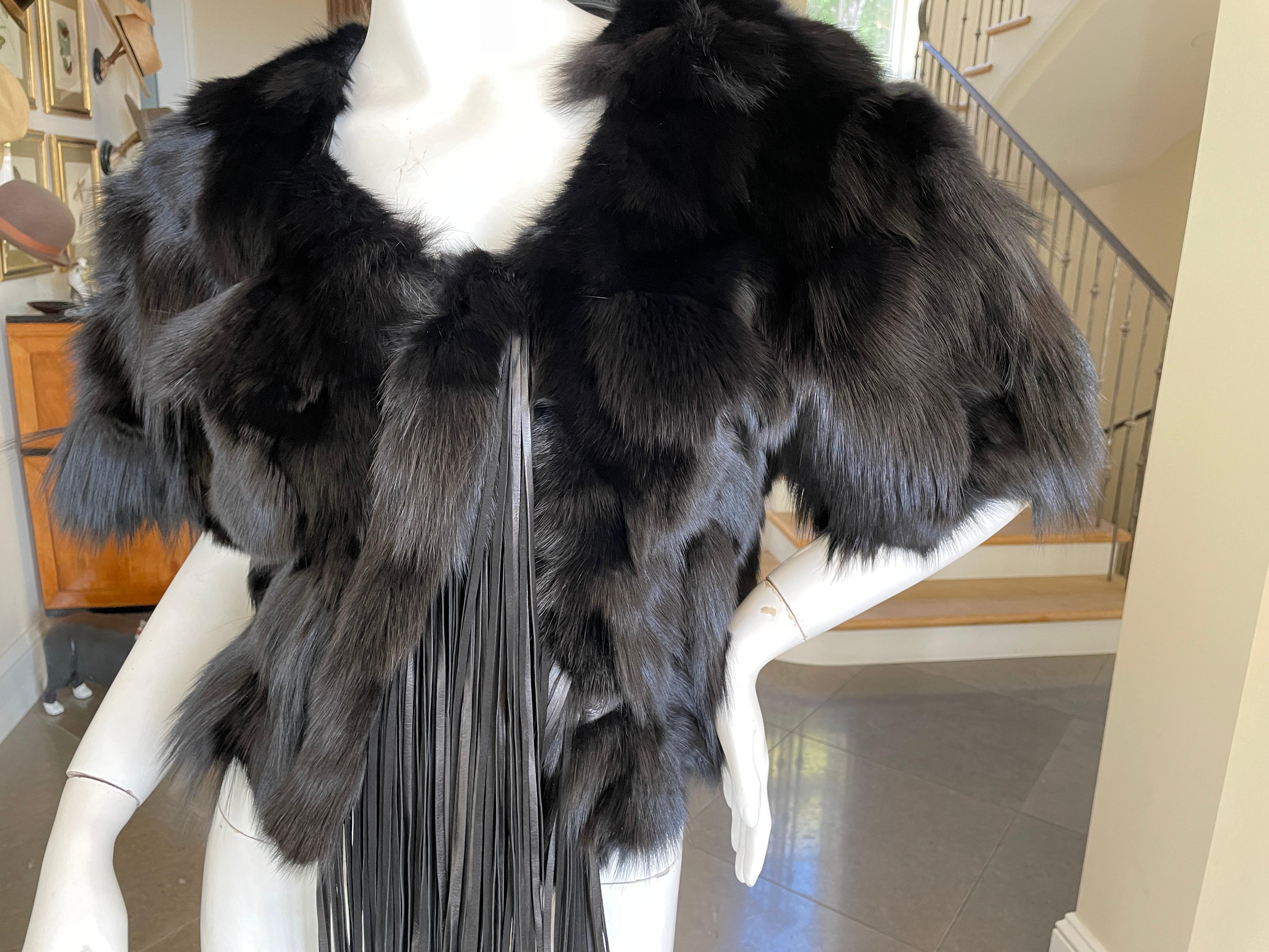 Roberto Cavalli Vintage Black Fox Fur Bolero Jacket with Leather Fringe
Please use the zoom feature to see all the great details.
Size 42
Bust 38