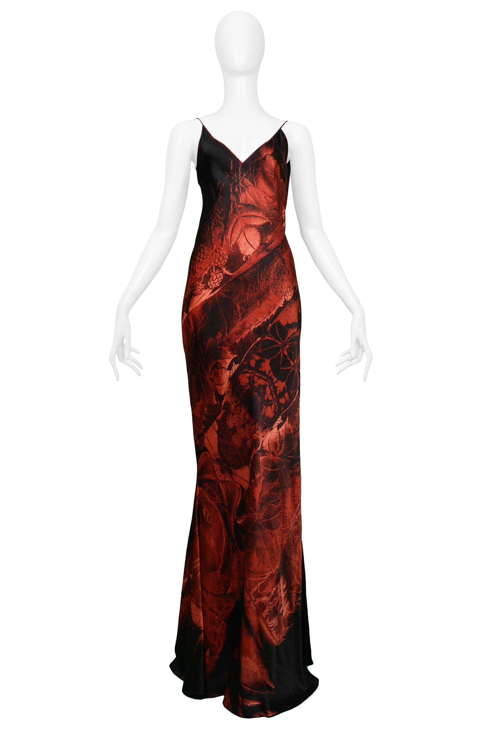 Resurrection Vintage is excited to present a vintage Roberto Cavalli silk evening gown featuring a red and black abstract floral print and draped open back.

Roberto Cavalli
Size: Extra Small
Silk
Excellent Vintage Condition 
Authenticity Guaranteed 