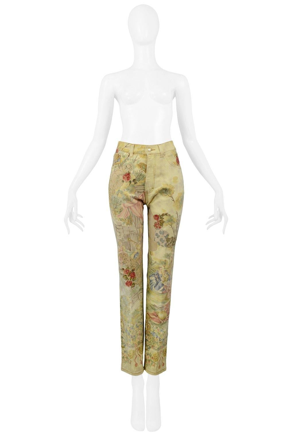 Resurrection is pleased to offer a pair of vintage Roberto Cavalli pale yellow denim high waisted pants with all-over Victorian-style floral and figure print with suede applique patches, center-front zipper with gold-tone hardware, and straight leg