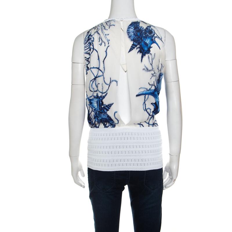 Think of creativity and Roberto Cavalli brings to you this artistic top to make a bold statement. This sleeveless top is made of a blend of fabrics and features a lovely white and blue printed pattern at the back with a cutout detailing. From the